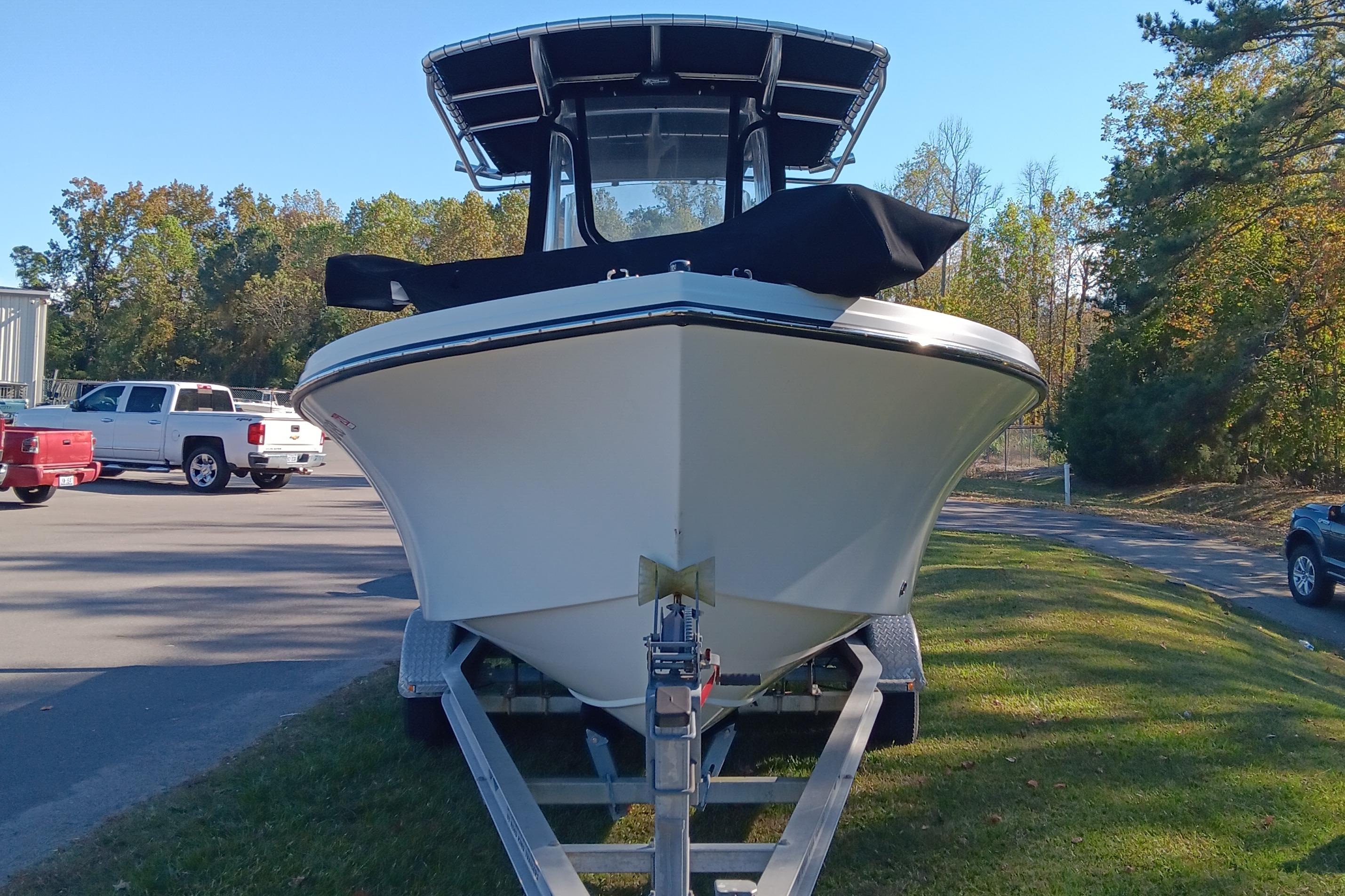 2016 Parker 2300 Special Edition boat on trailer, parked outdoors.