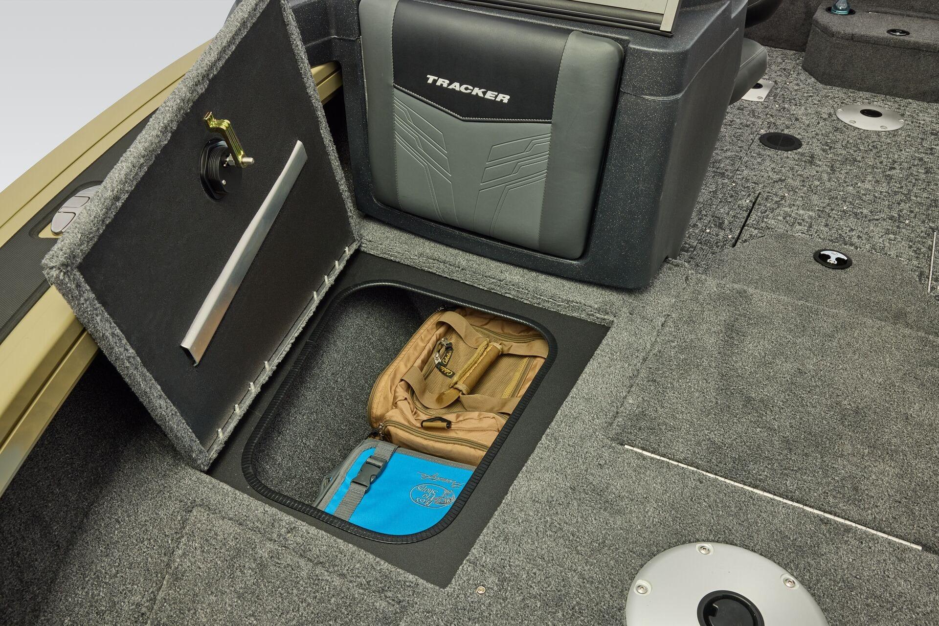 2026 Tracker Targa V-19 Combo boat storage compartment with gear inside.
