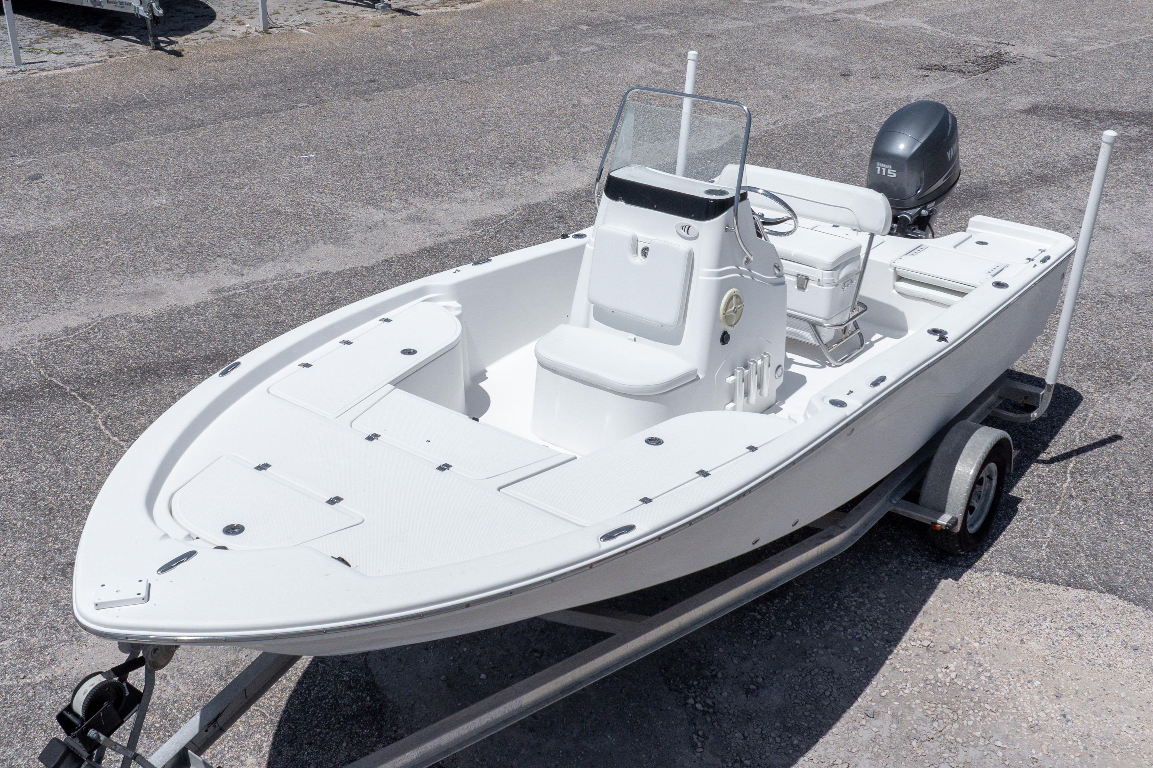 2011 Sea Fox 200XT boat on trailer, featuring a sleek white design and Yamaha outboard motor.