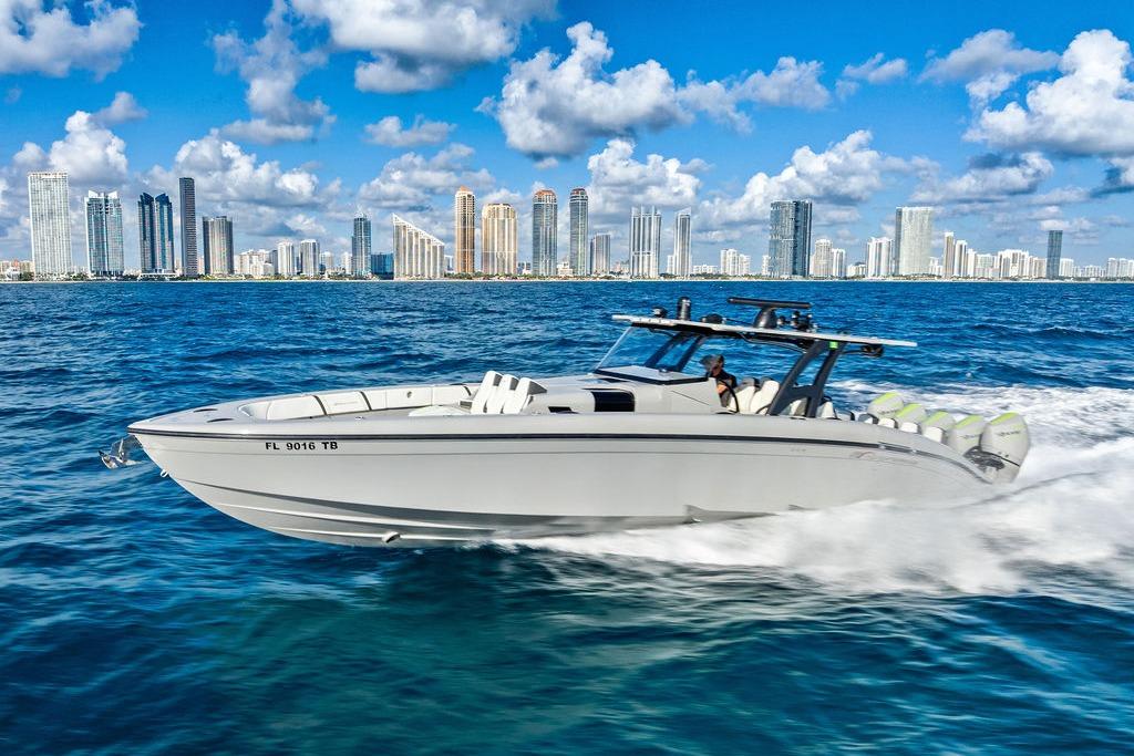 2022 Midnight Express 43' Solstice boat cruising near city skyline on a sunny day.