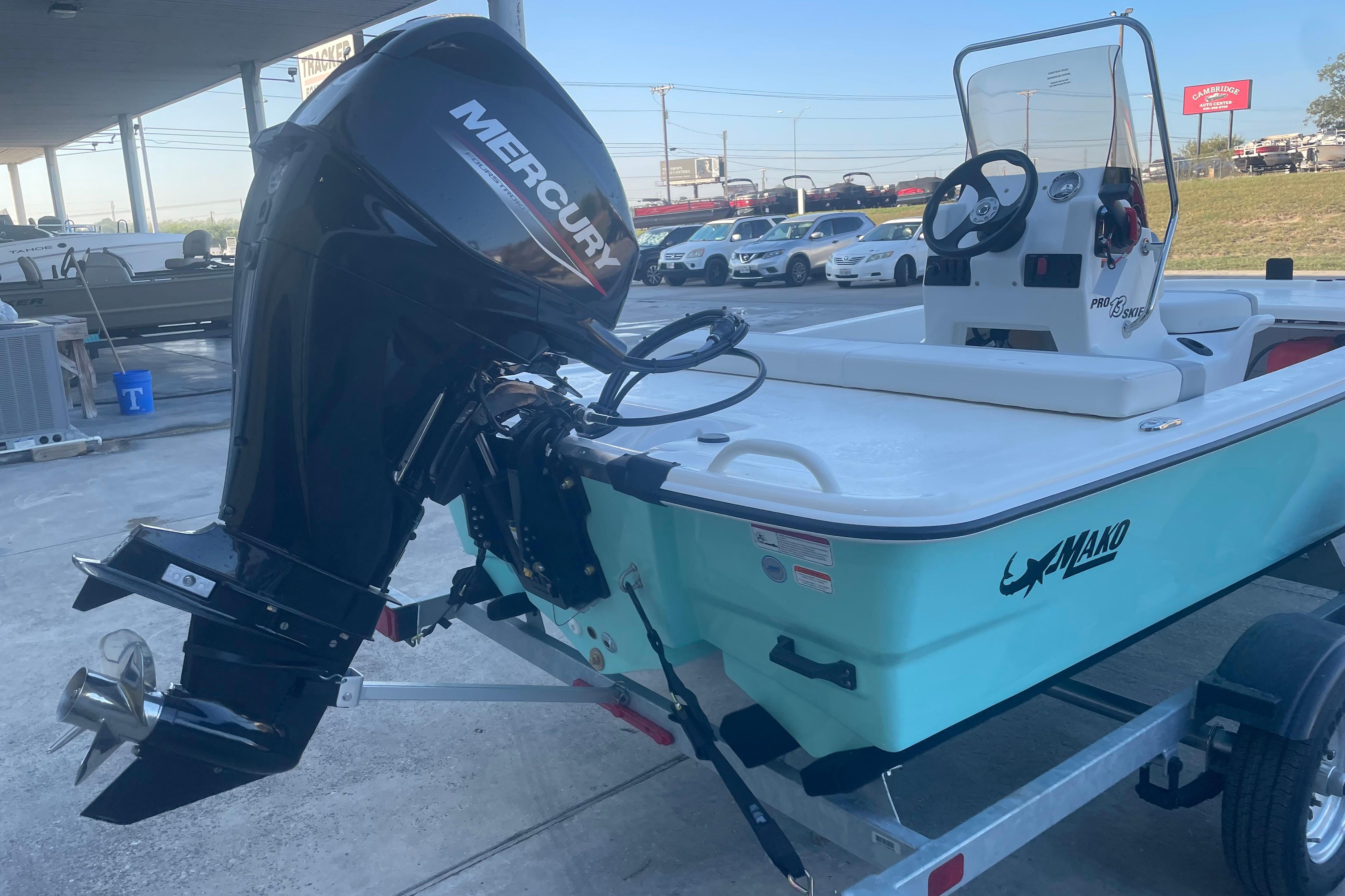 2026 Mako Pro Skiff 13 CC boat with Mercury outboard motor on trailer.