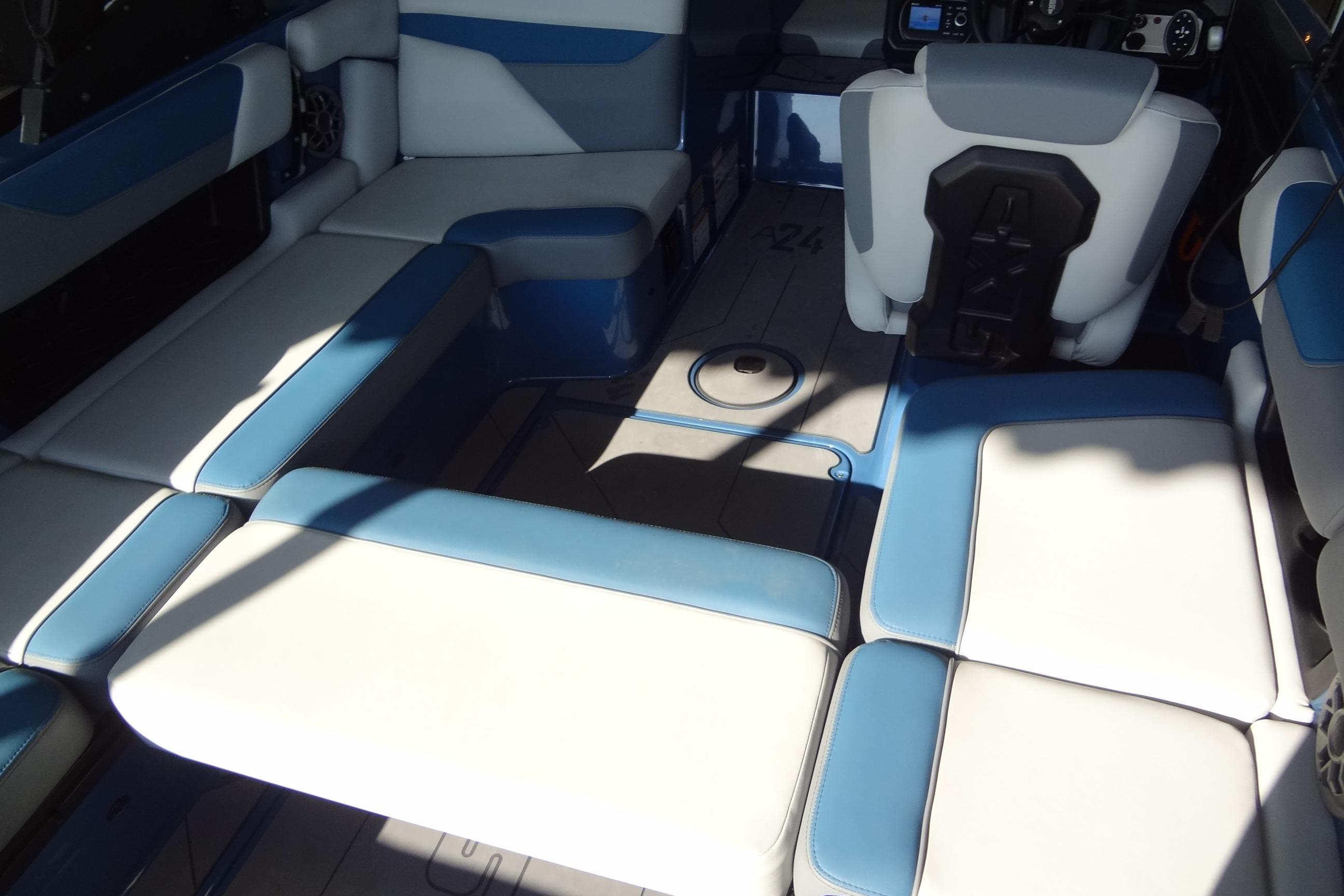 2021 Axis A24 boat interior with blue and white seating, showcasing modern design.