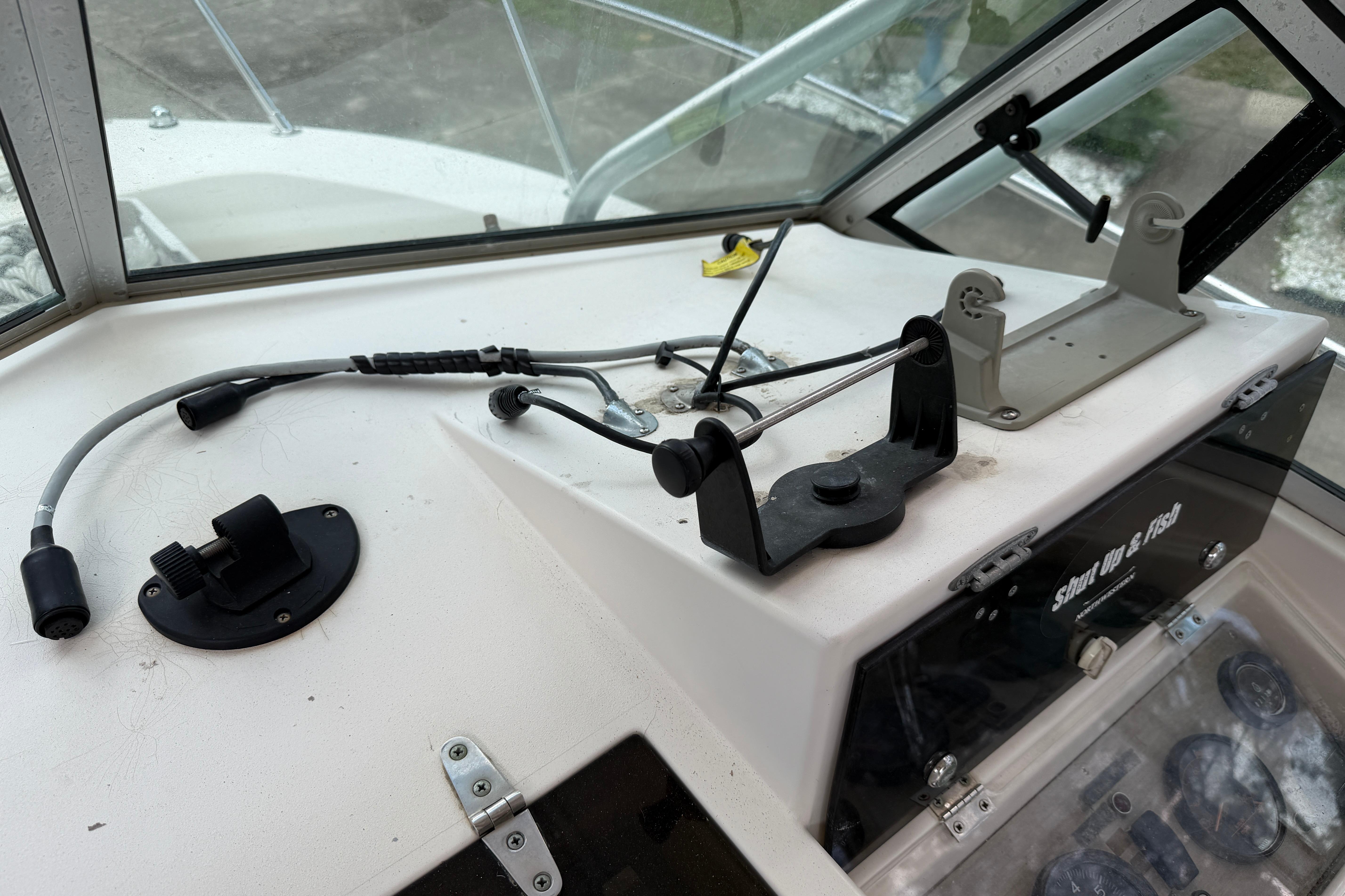Dashboard of a 1987 Grady-White Seafarer 226 boat with control panel and wiring.