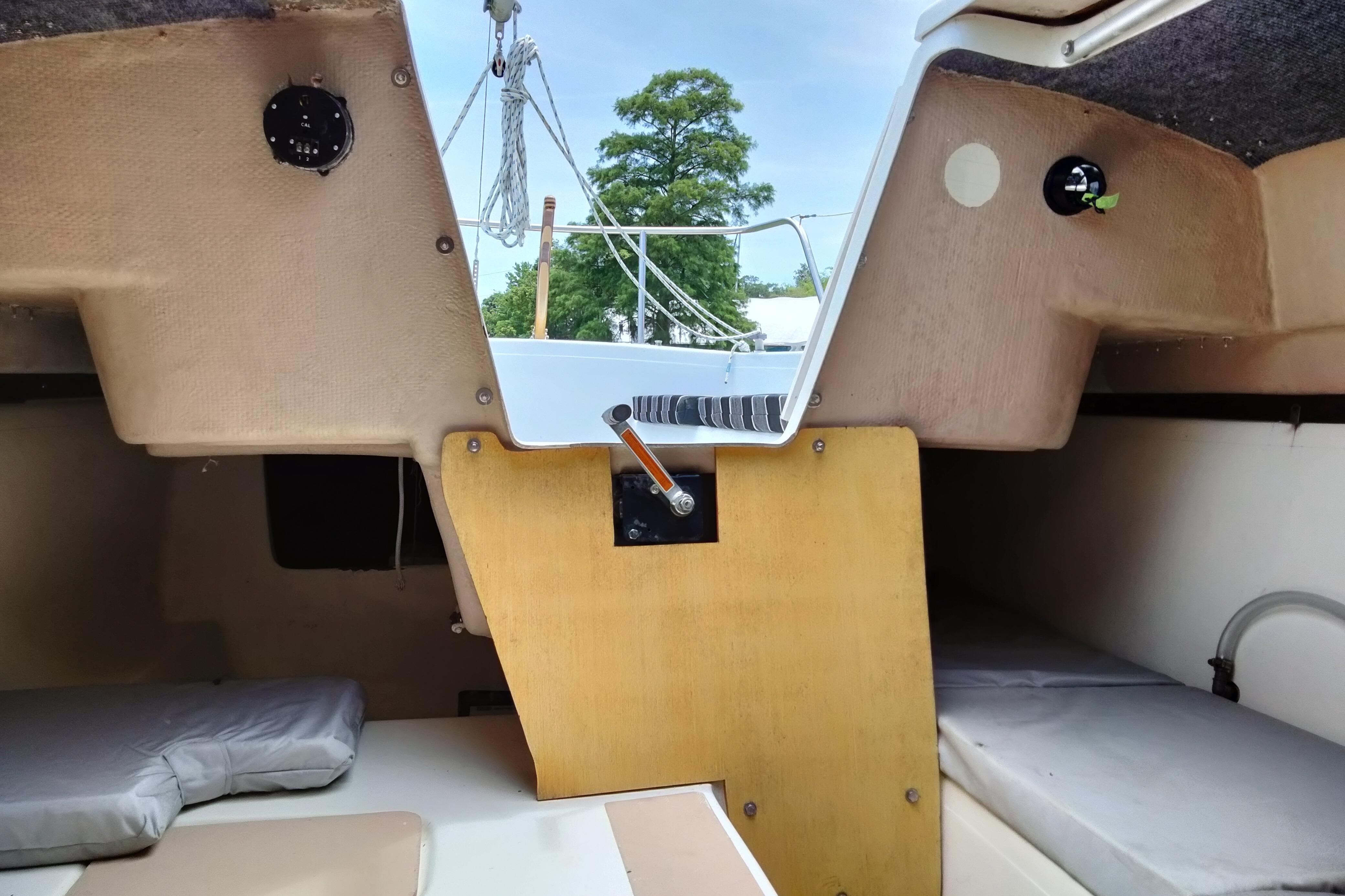 Interior view of a 1980 MacGregor 25 sailboat cabin with sleeping berths.