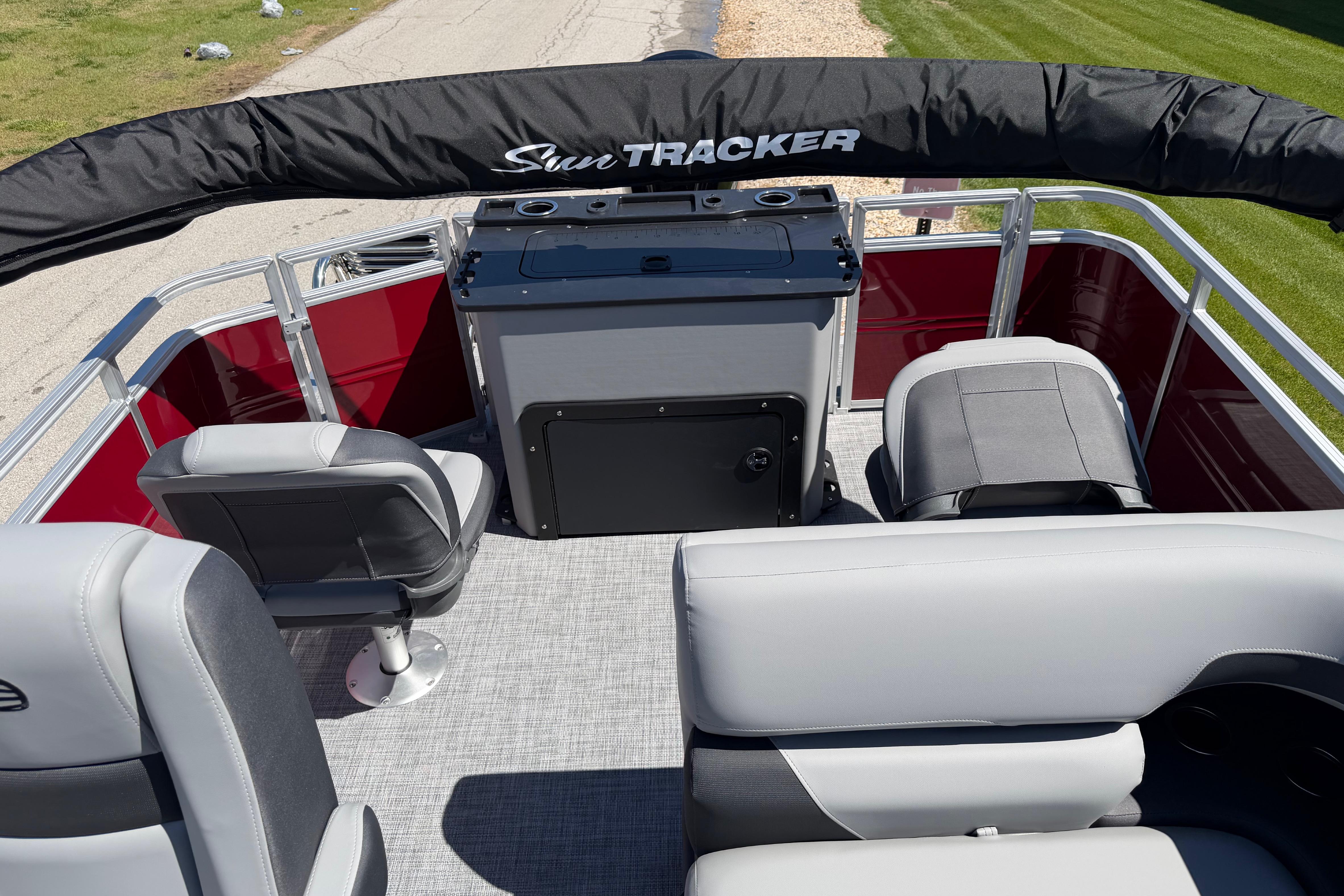 2026 Sun Tracker SportFish 20 DLX pontoon boat interior with seating and helm.