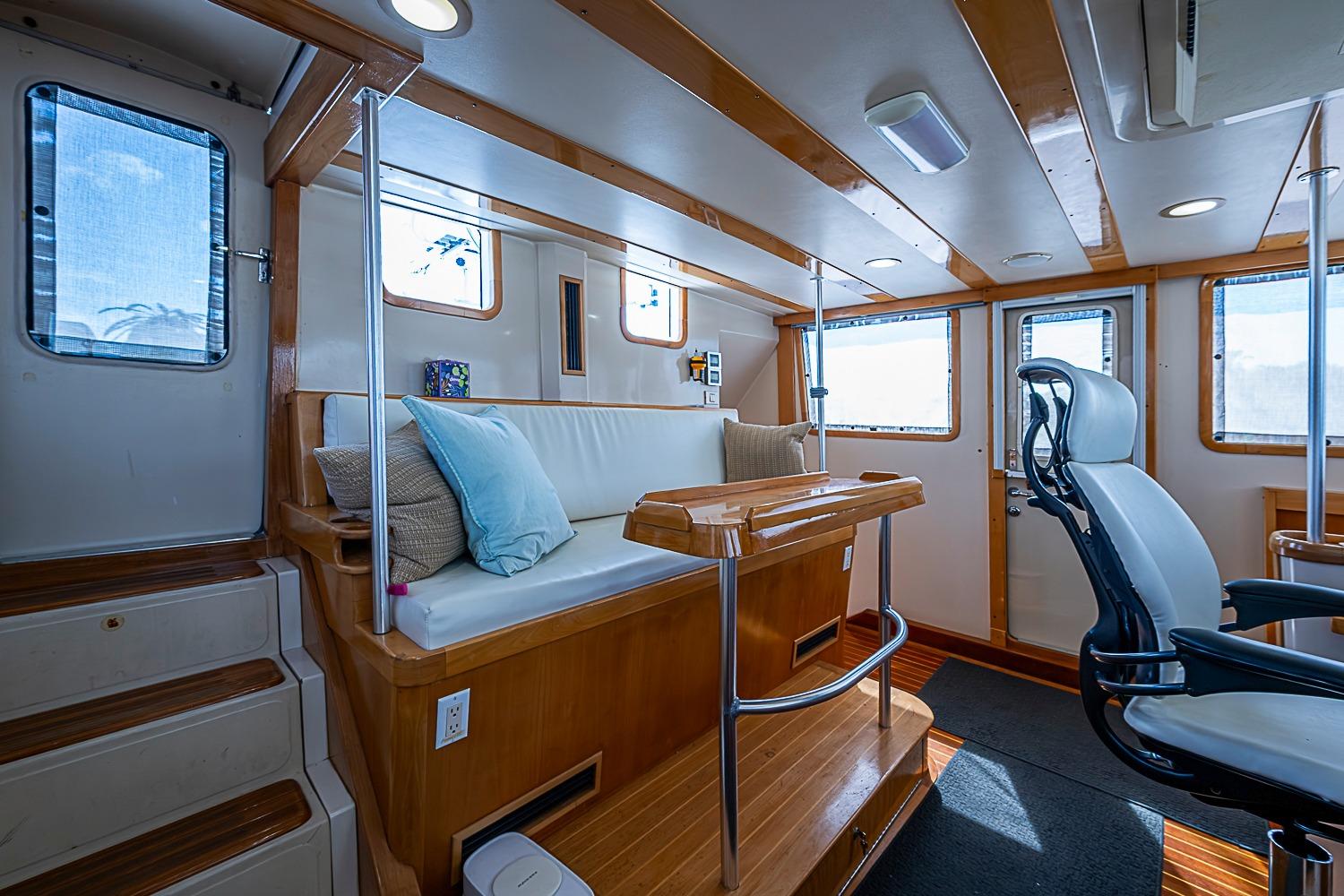 Interior of 2003 Magna Marine Nova Scotia 47, featuring seating and helm station.