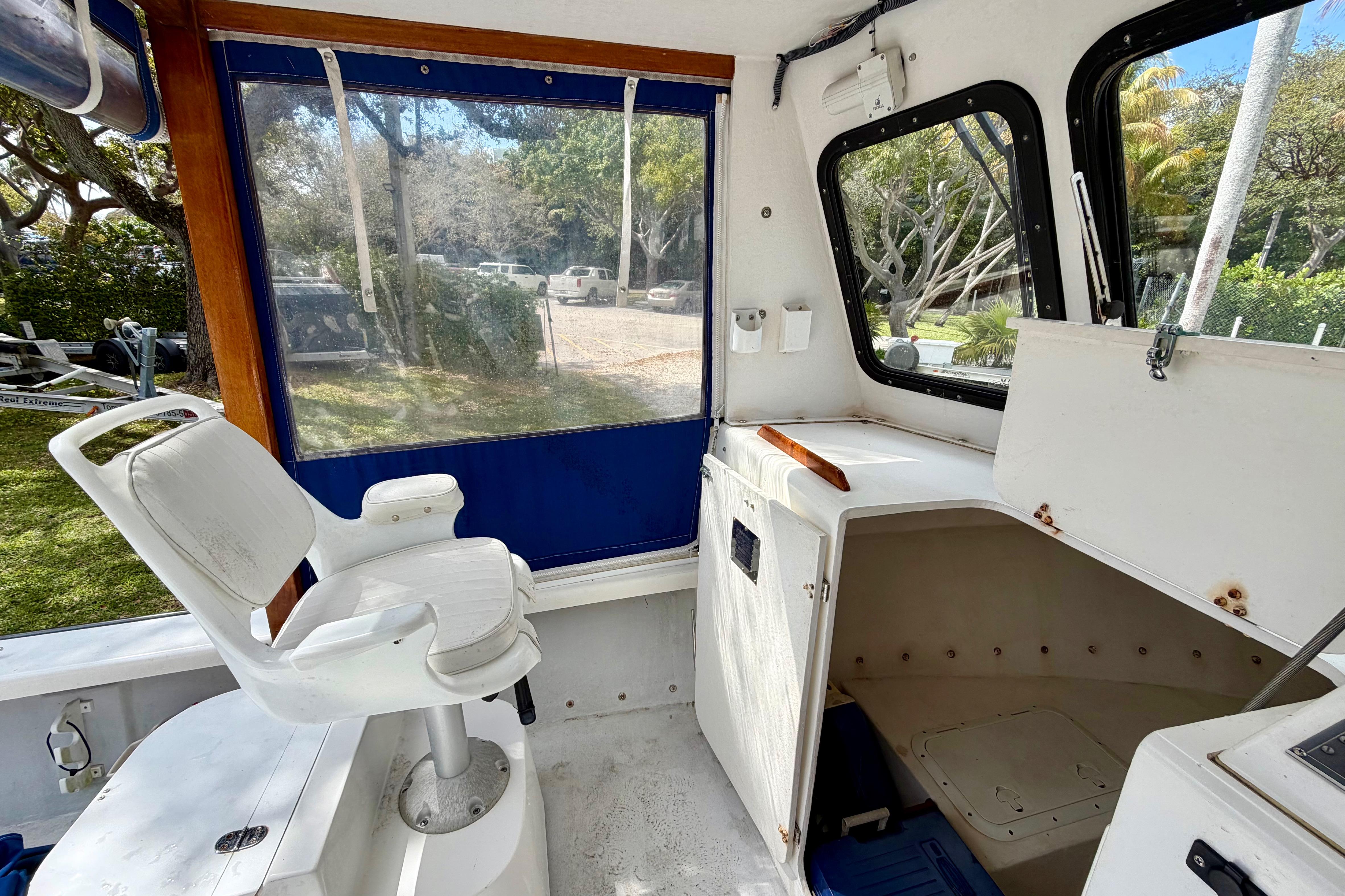 Interior of a 2000 Eastern 22 Lobster Fisherman boat with seating and storage.