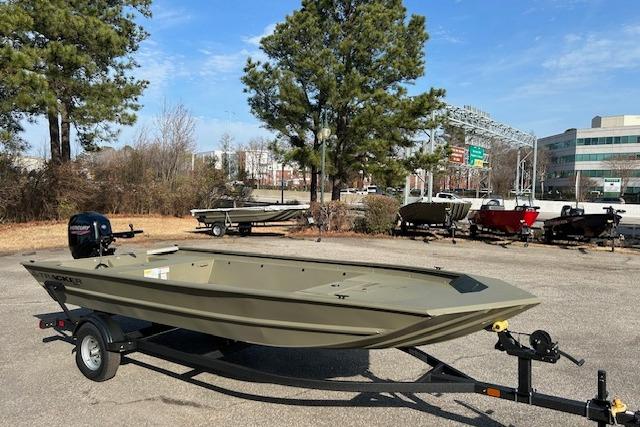 2026 Tracker Grizzly 1860 Utility boat on trailer in outdoor setting.