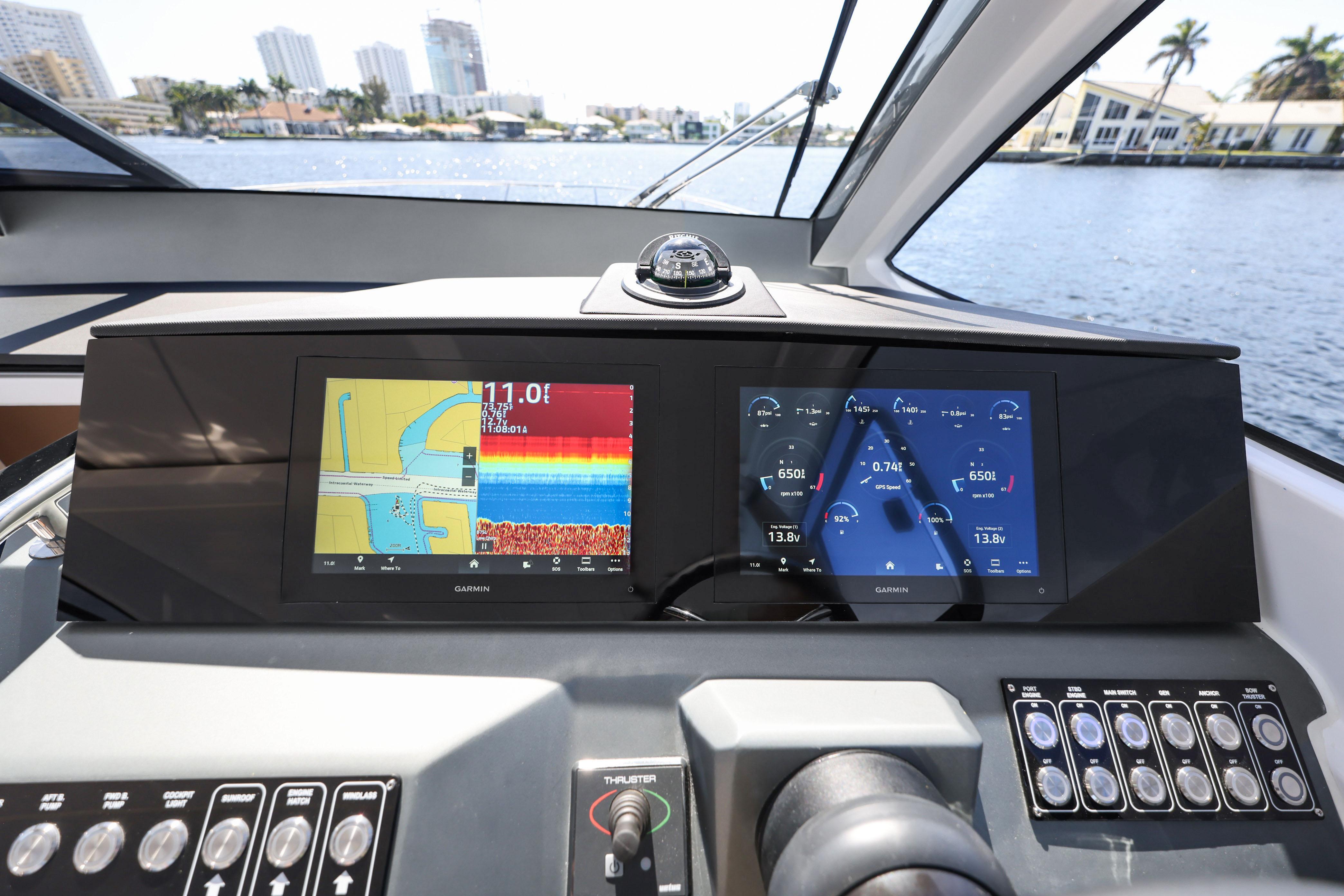 Dashboard of 2025 Valiatt 380 Bowrider with Garmin navigation displays on water.