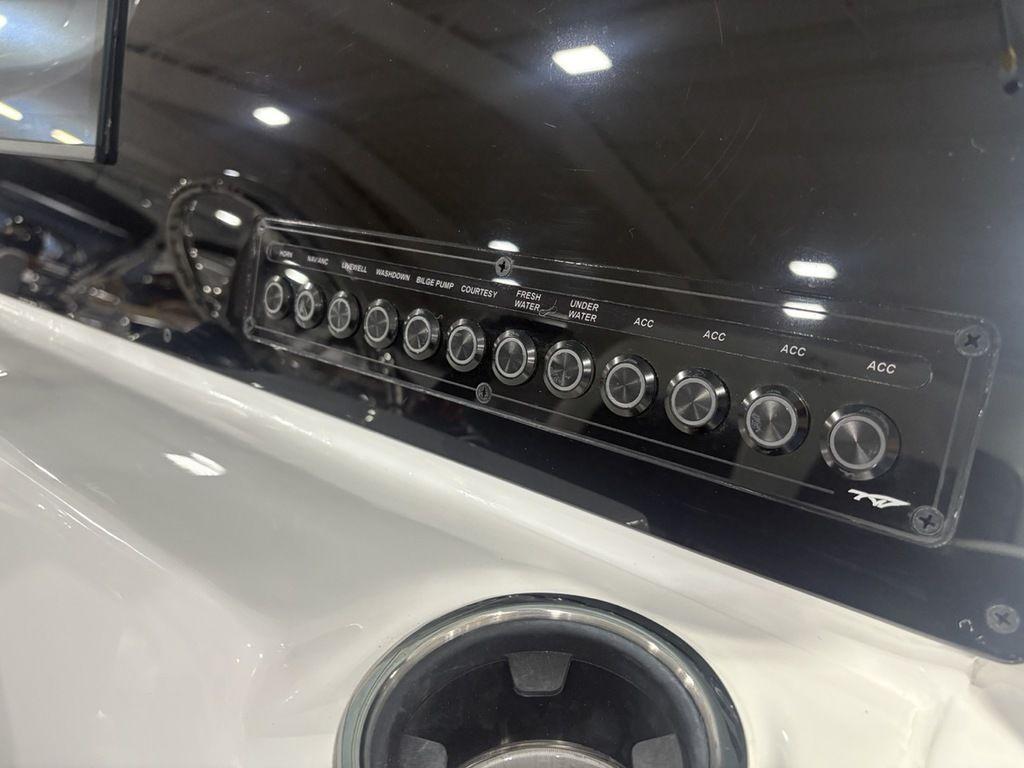 Control panel of 2026 Tidewater 2110 BM boat with labeled switches.