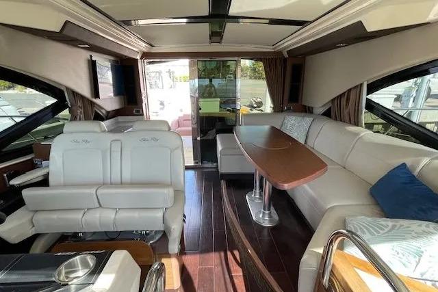 Luxurious interior of a 2016 Sea Ray Sundancer 510 yacht with elegant seating and wooden accents.