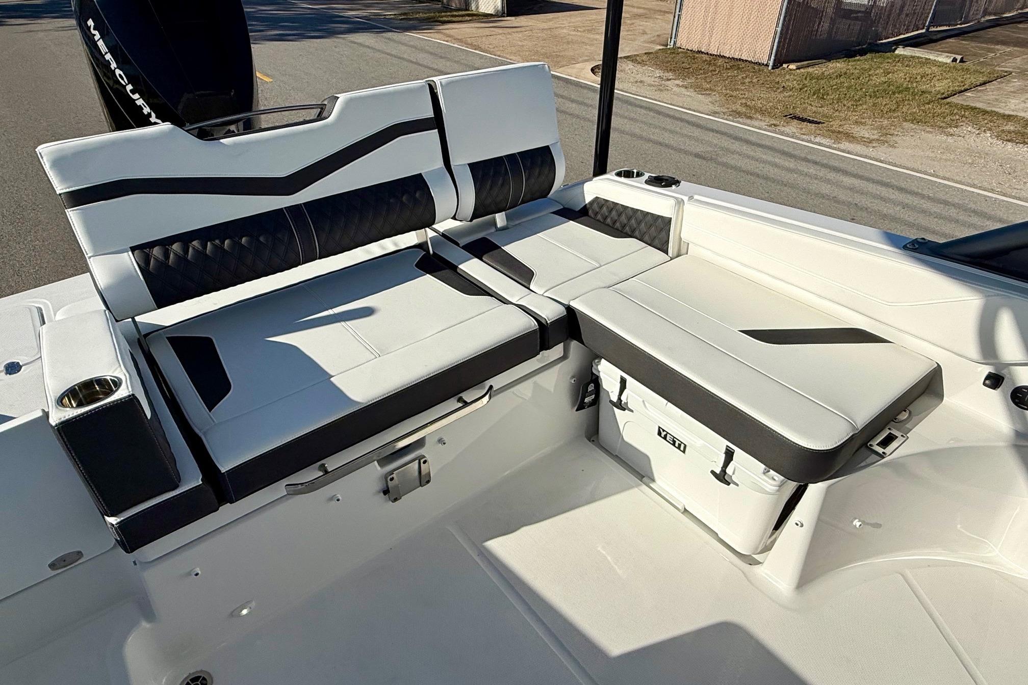 Interior of 2026 Monterey Elite 27 OB with seating and cooler.