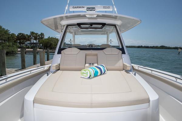 Manufacturer Provided Image: 2018 Pursuit S 368 Sport boat with sunbed and striped towel.