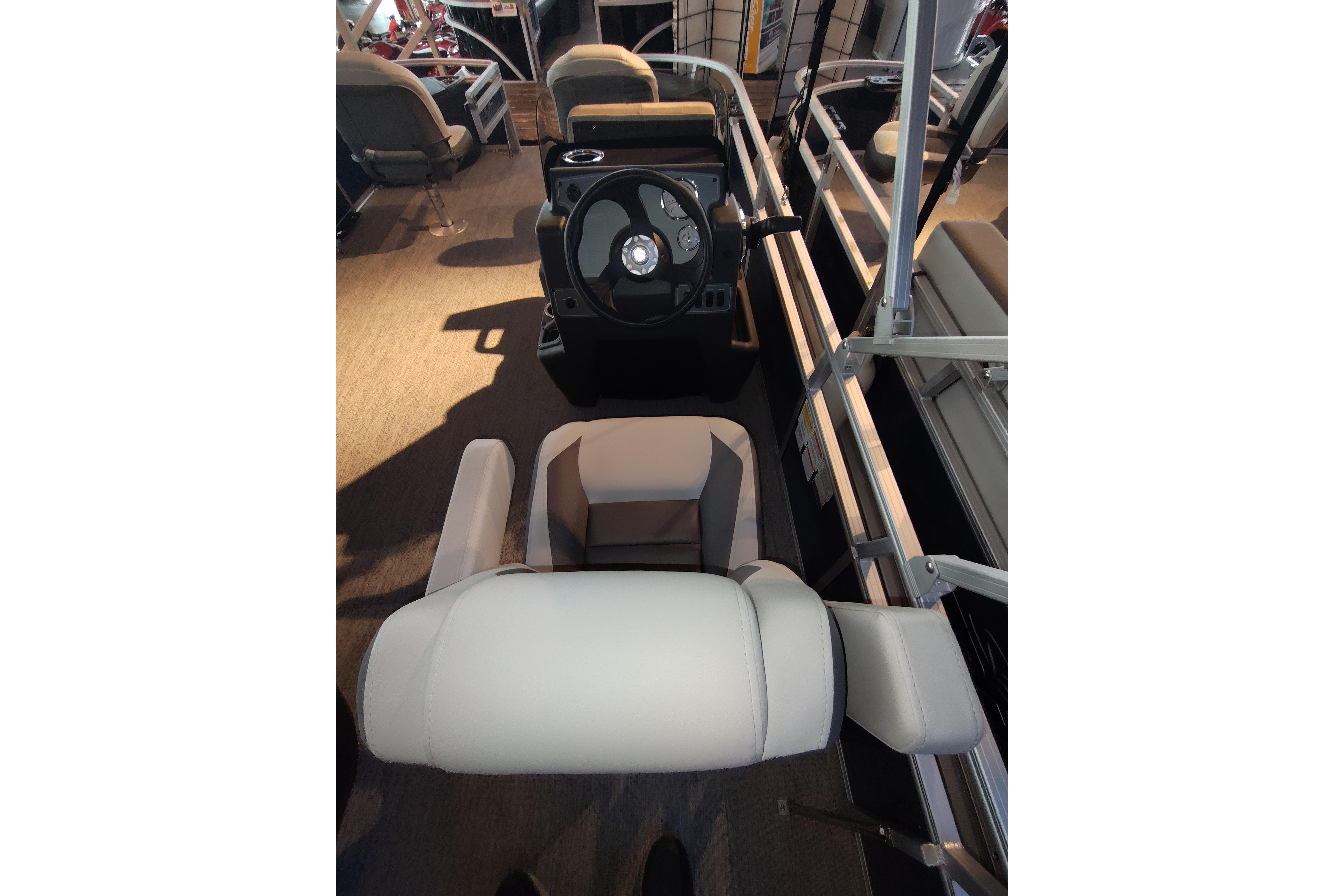 2026 Sun Tracker Bass Buggy 18 DLX interior with steering wheel and seating.