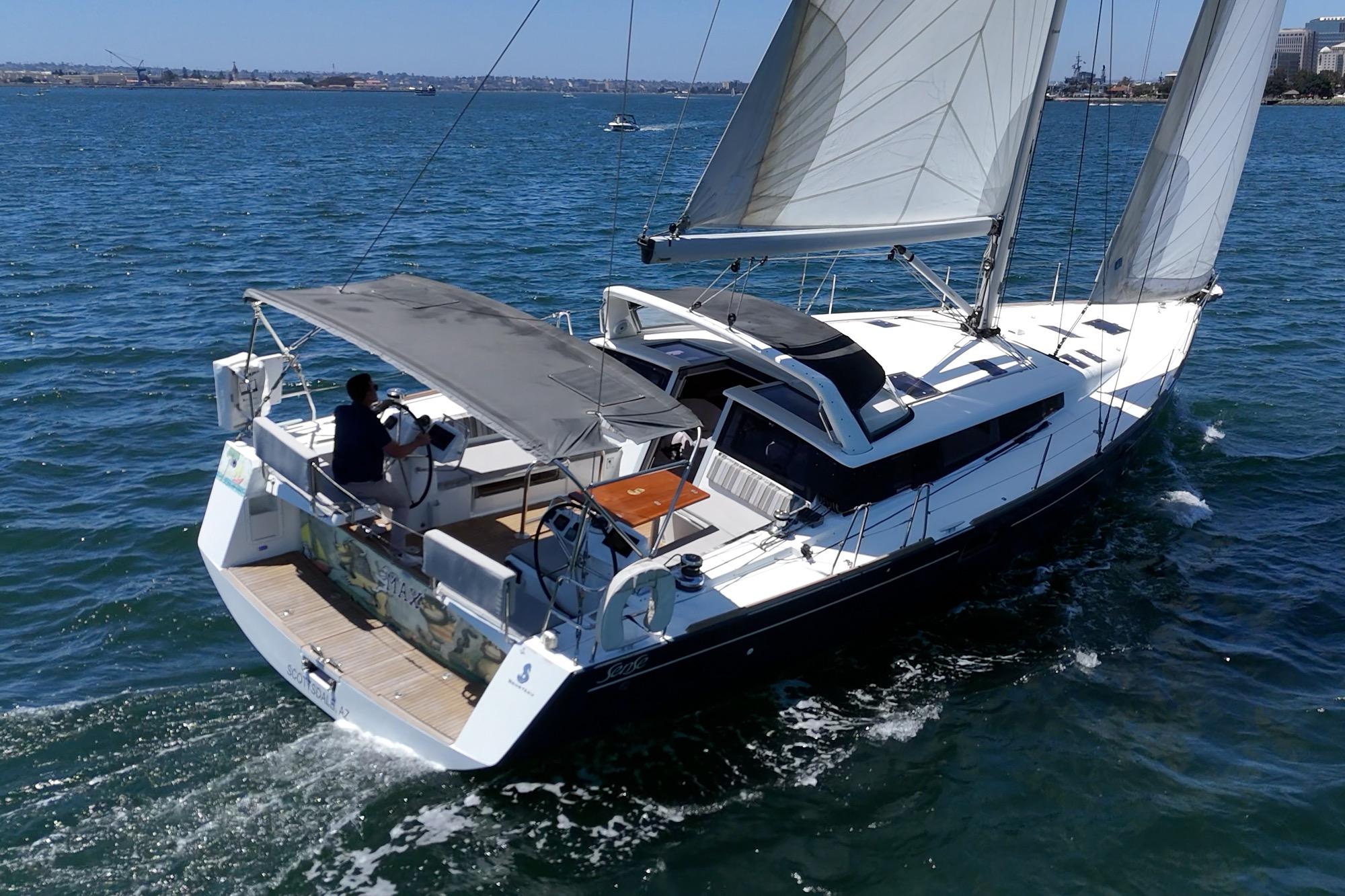 Sailing on open water, 2017 Beneteau Sense 50 yacht with sails unfurled.