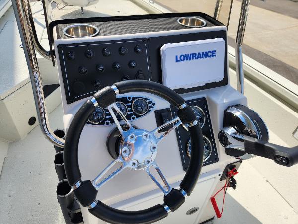 Steering console of 2025 Ranger RB200 boat with Lowrance electronics and control panel.
