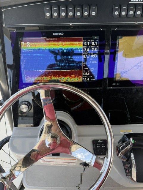 2023 Boston Whaler 330 Outrage helm with Simrad displays.