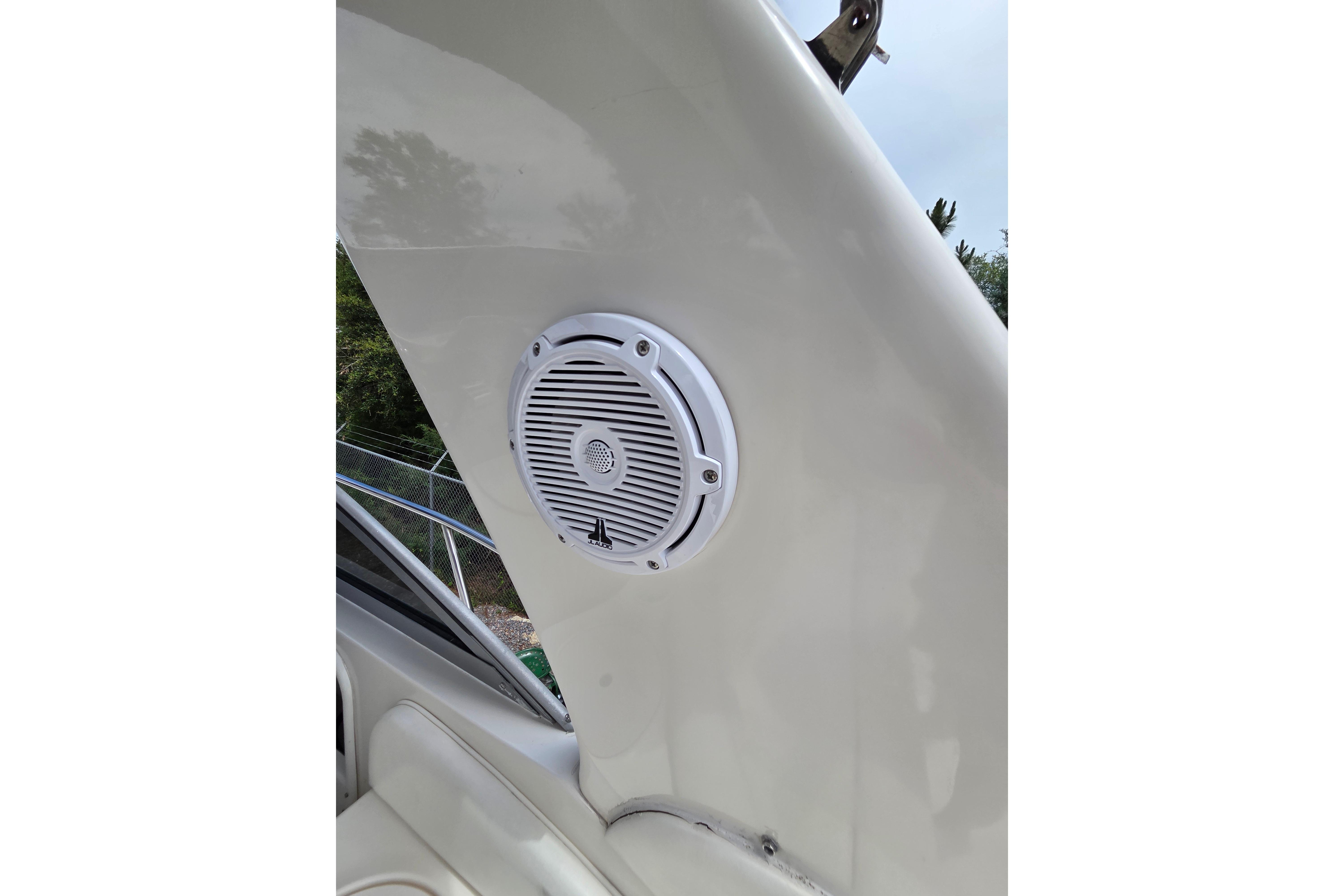 Speaker installed on a 2000 Sea Ray 340 Sundancer boat, showcasing marine audio equipment.