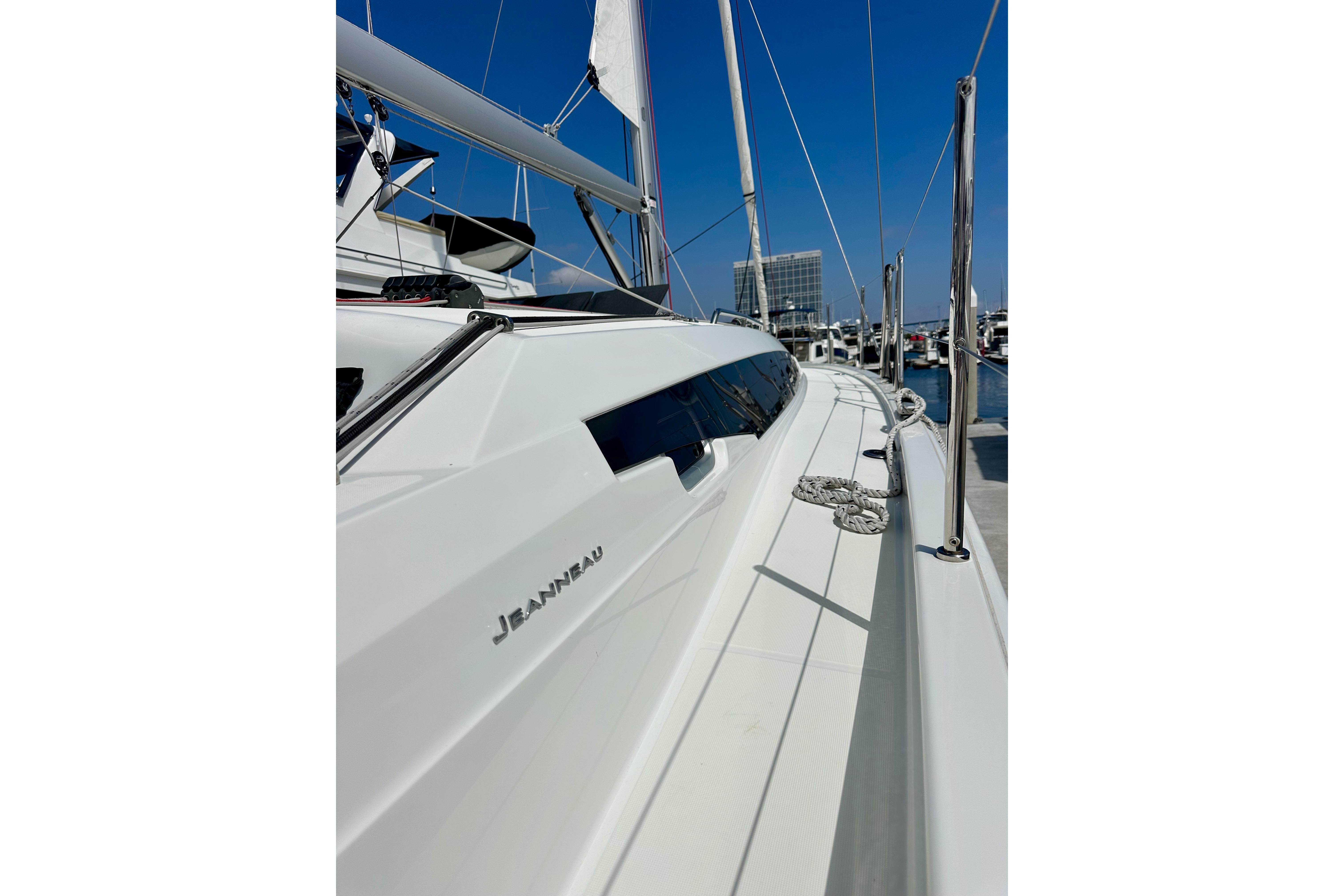 2024 Jeanneau Sun Odyssey 410 sailboat docked, showcasing sleek design and modern features.