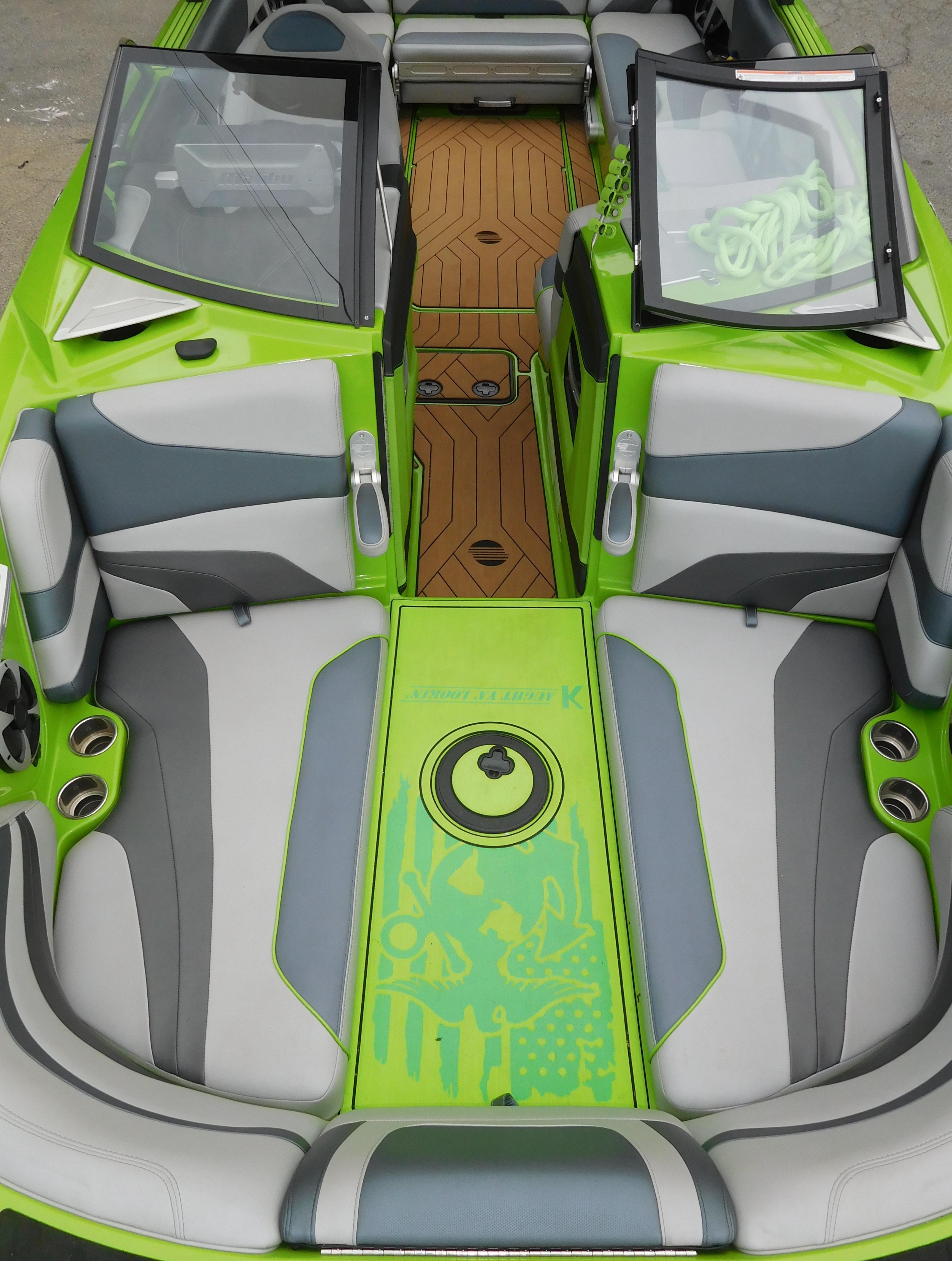 2017 Malibu Wakesetter 24 MXZ interior with green and gray seating.