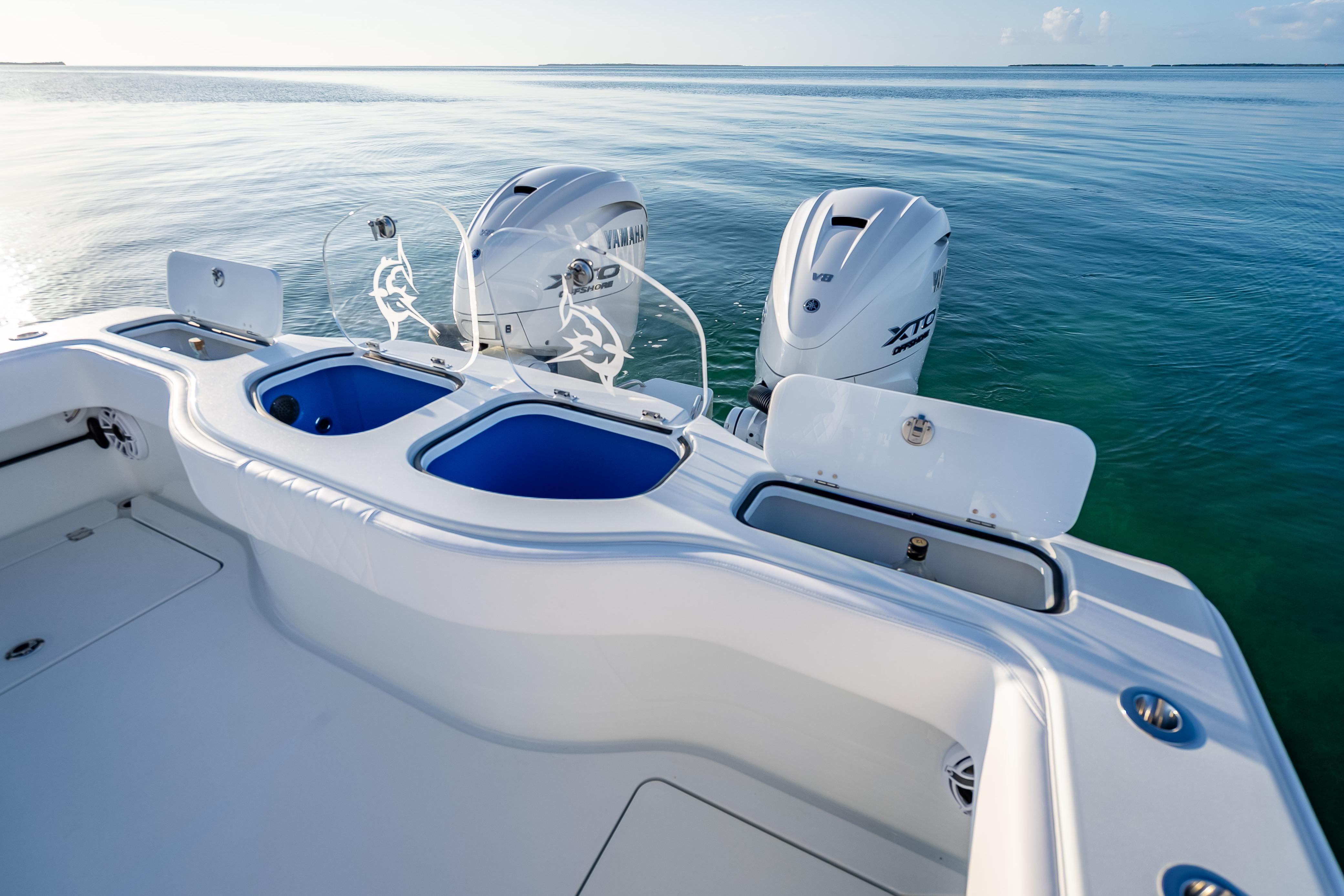 2026 Freeman 35 boat with Yamaha engines on calm water.