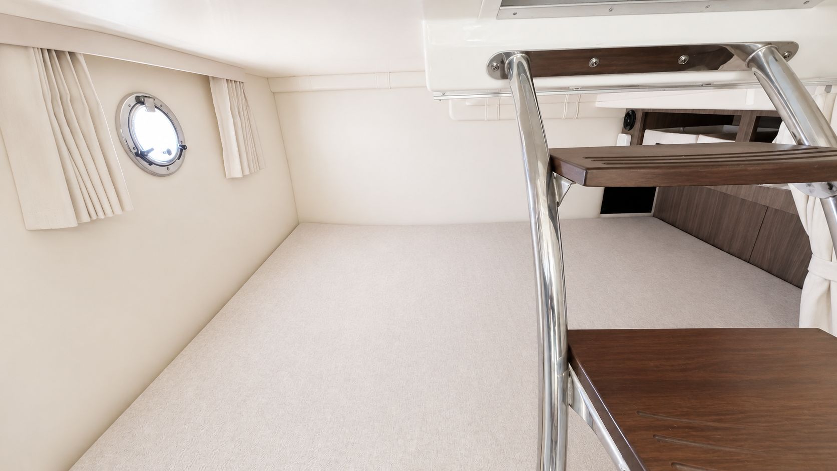 Interior of the 2020 Regal 28 Express with stairs and a porthole.