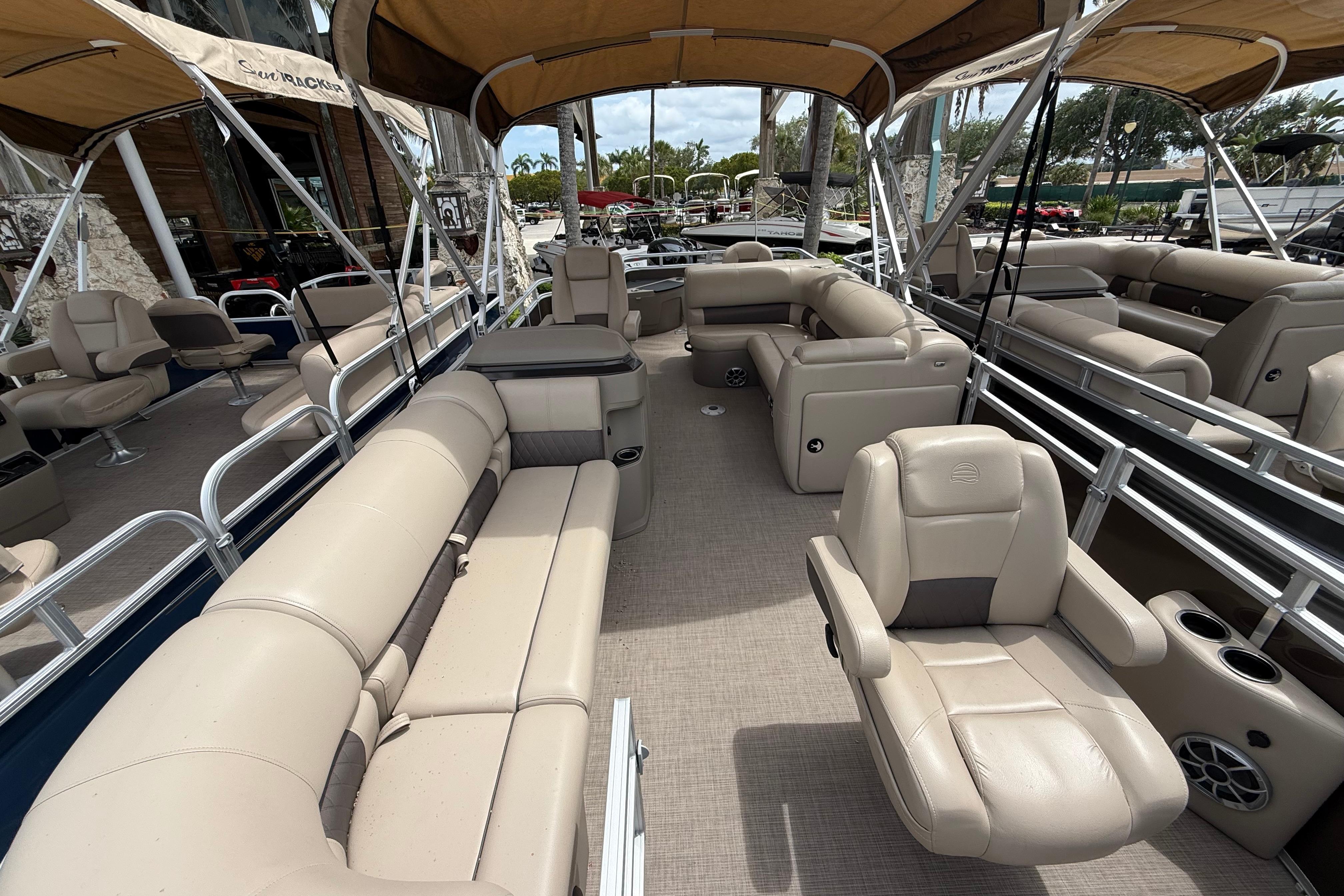 2025 Sun Tracker SportFish 20 DLX pontoon boat with spacious seating and modern design.