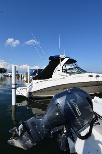 2021 Eastern 248 Center Console boat docked with Yamaha outboard motor.