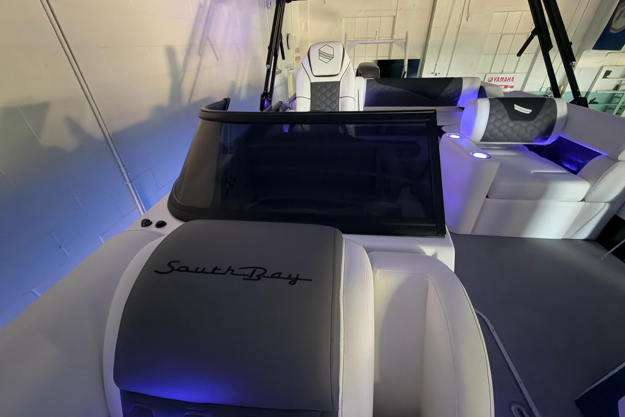 2026 South Bay 525SB2 boat interior with modern seating and ambient lighting.