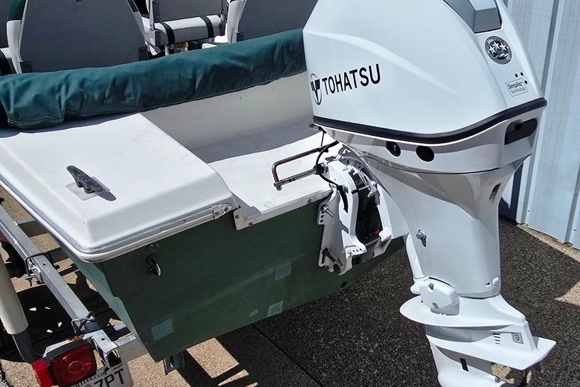 1971 Jupiter 15' Tri Hull boat with Tohatsu outboard motor on trailer.