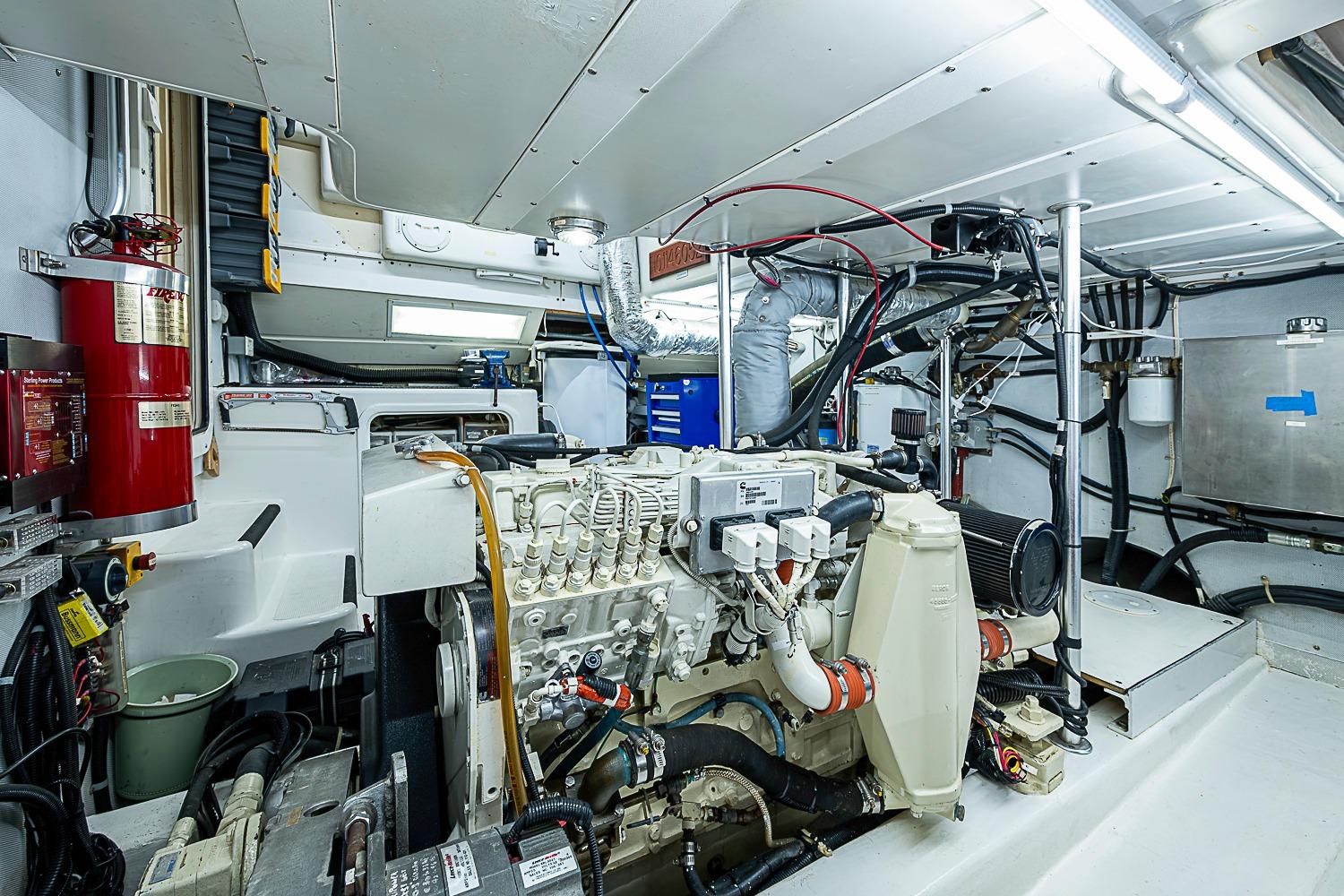 Engine room of 2003 Magna Marine Nova Scotia 47, featuring mechanical components and fire safety equipment.