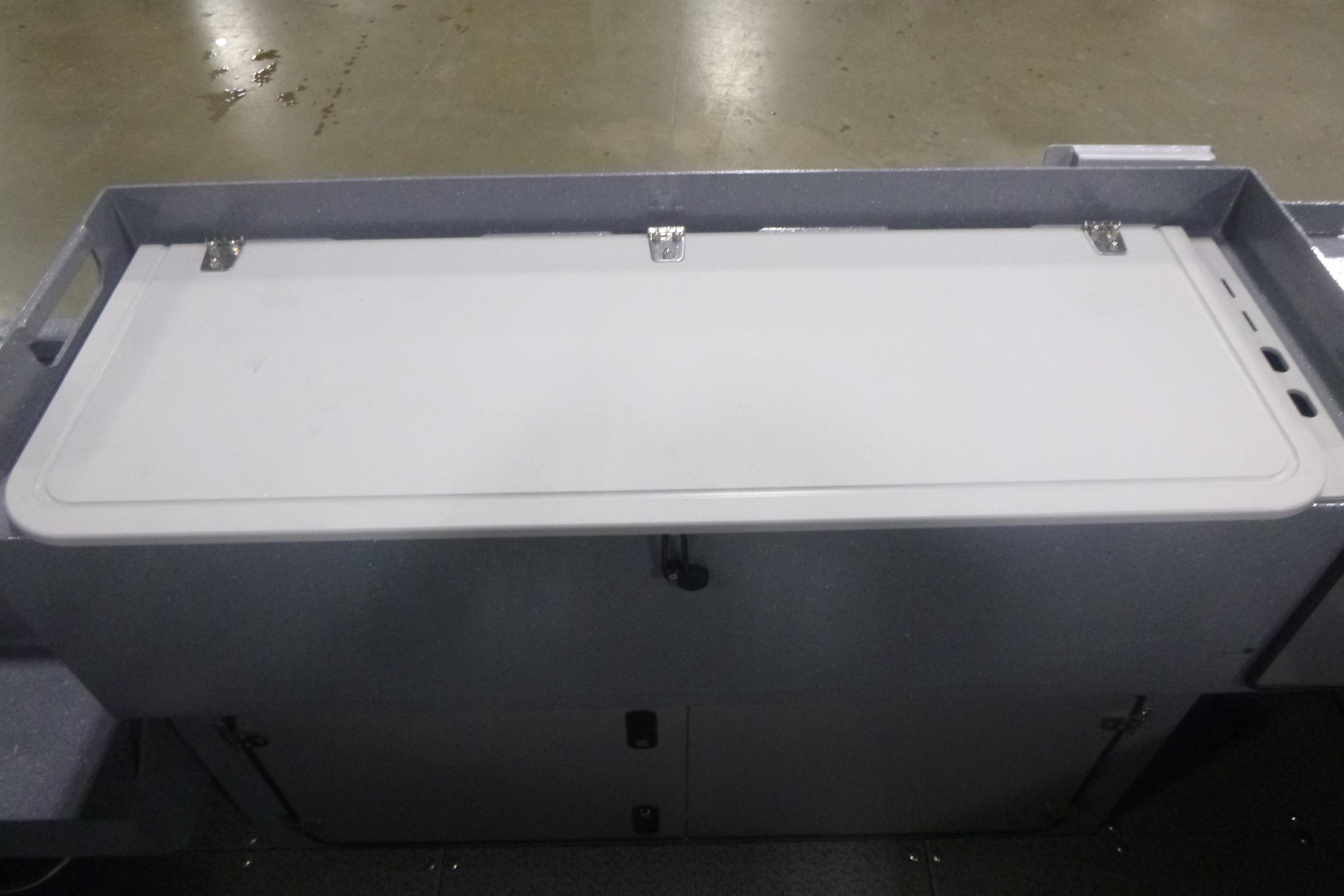 KingFisher 2425 Escape HT 2026 boat storage compartment with closed lid.