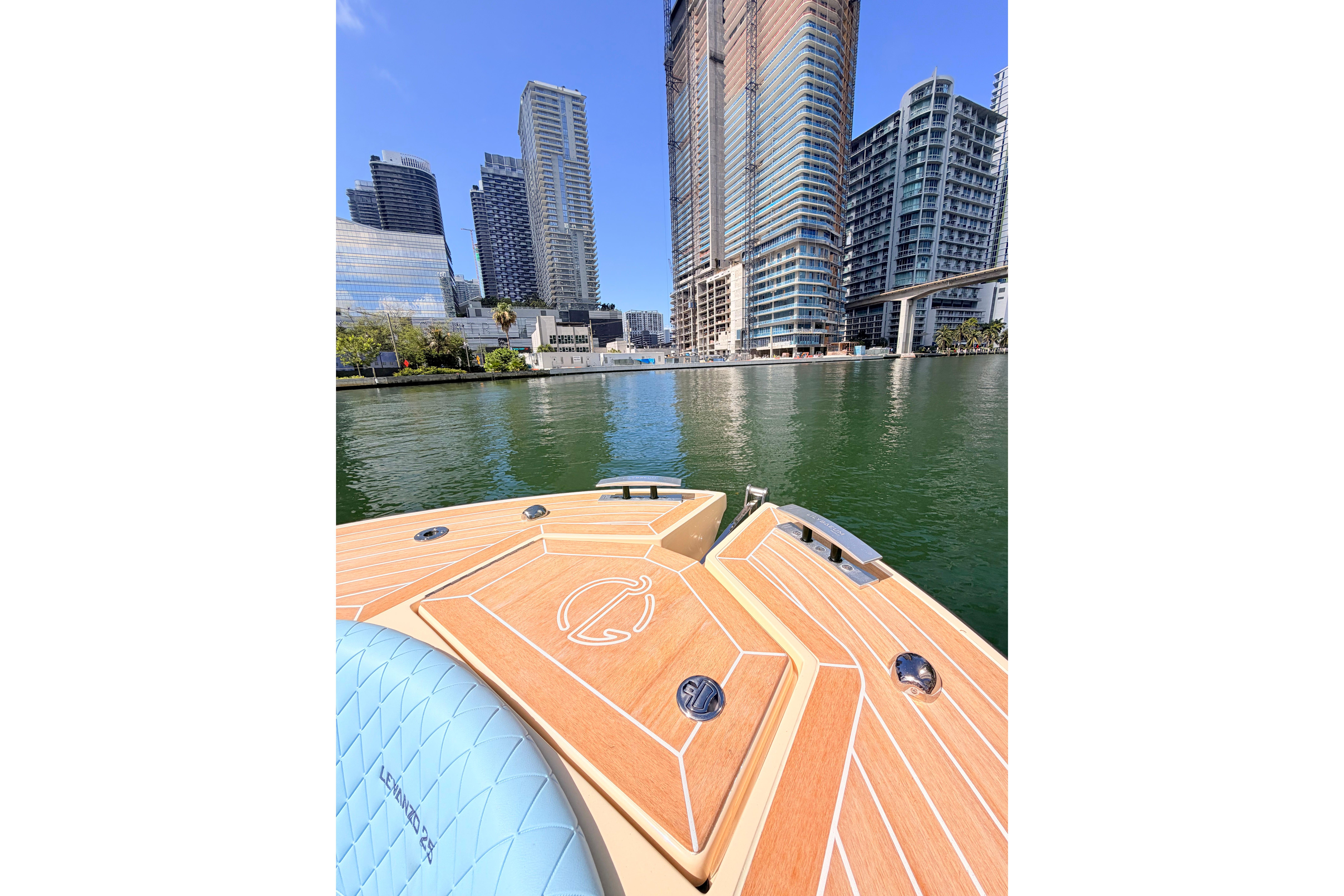 Lilybaeum Levanzo 25 boat cruising near modern city skyline, 2026 model.