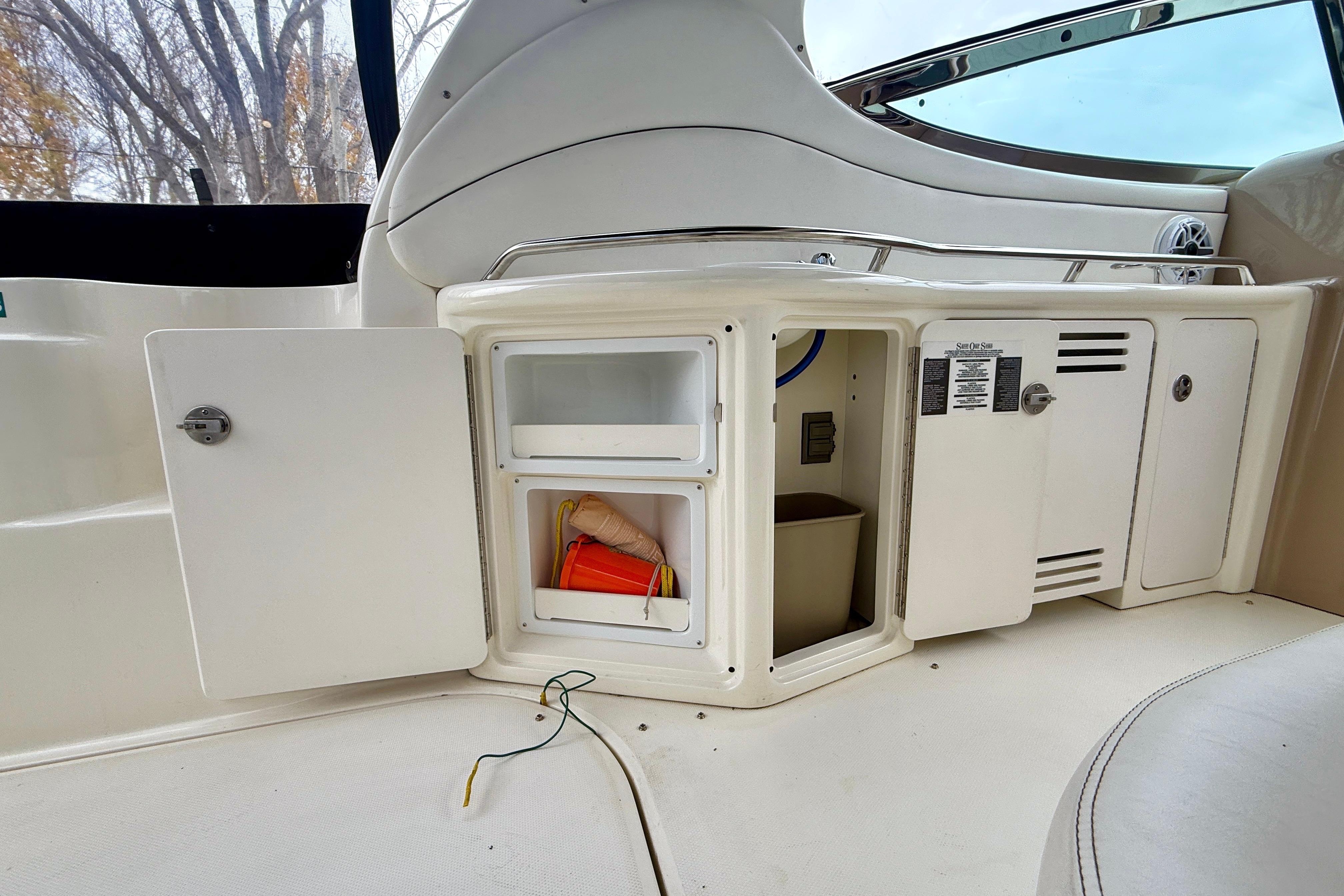 2004 Searay 360 Sundancer boat interior with open storage compartments.