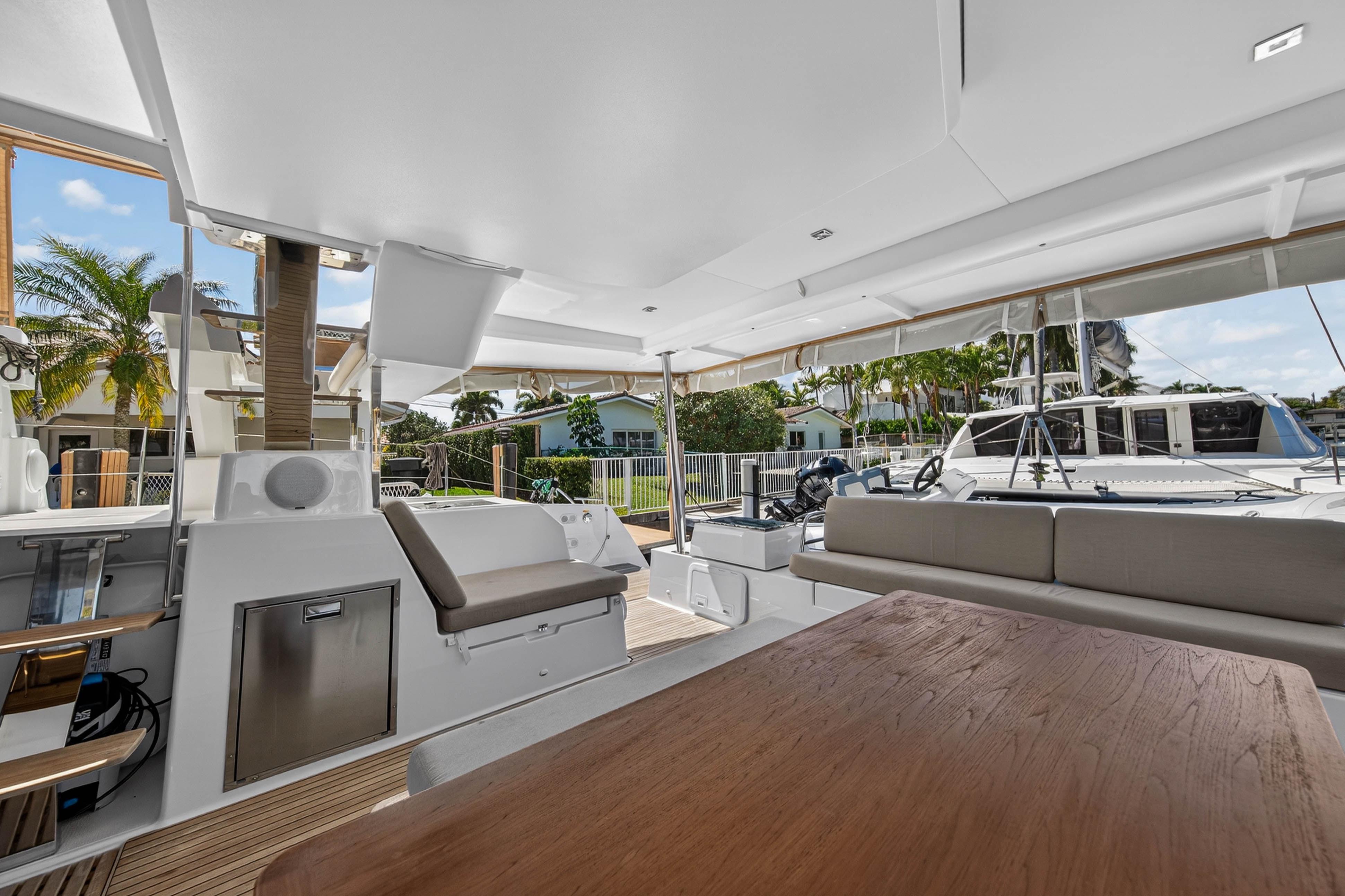 2022 Fountaine Pajot Tanna 47 yacht deck with seating and outdoor dining area.