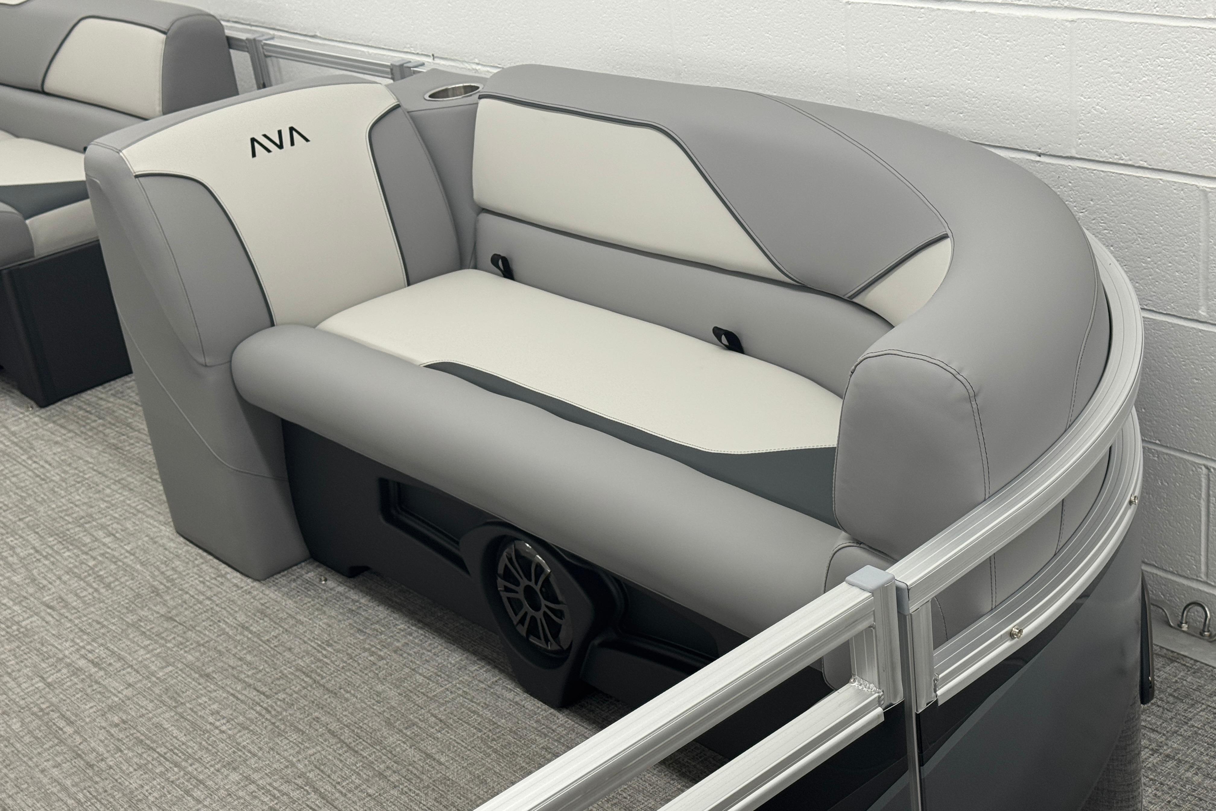 Luxurious seating in 2026 Avalon Ventue 85 RF pontoon boat, featuring sleek gray and white upholstery.