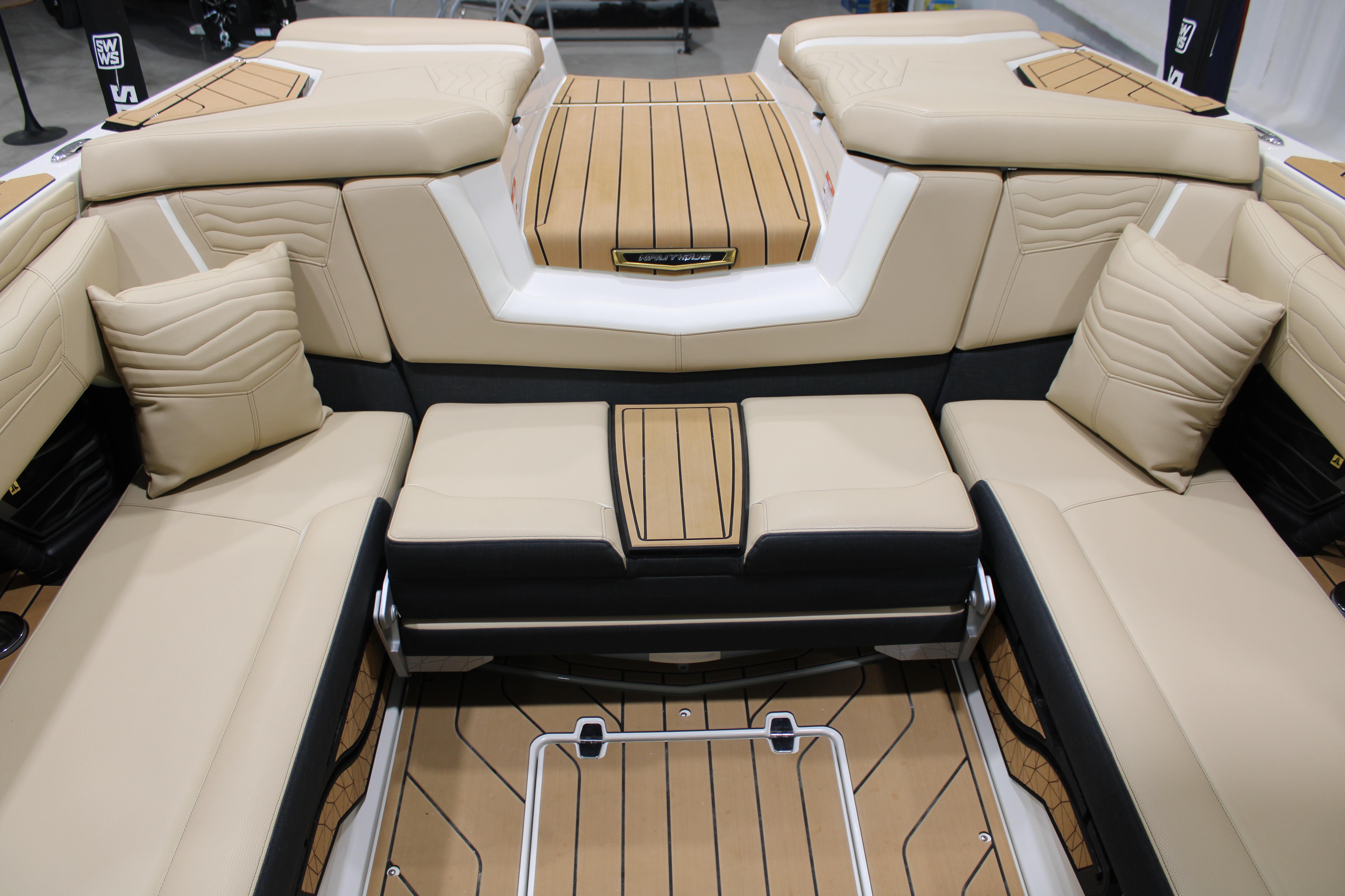 Luxurious interior of 2025 Nautique Super Air Nautique G25 boat with beige seating.