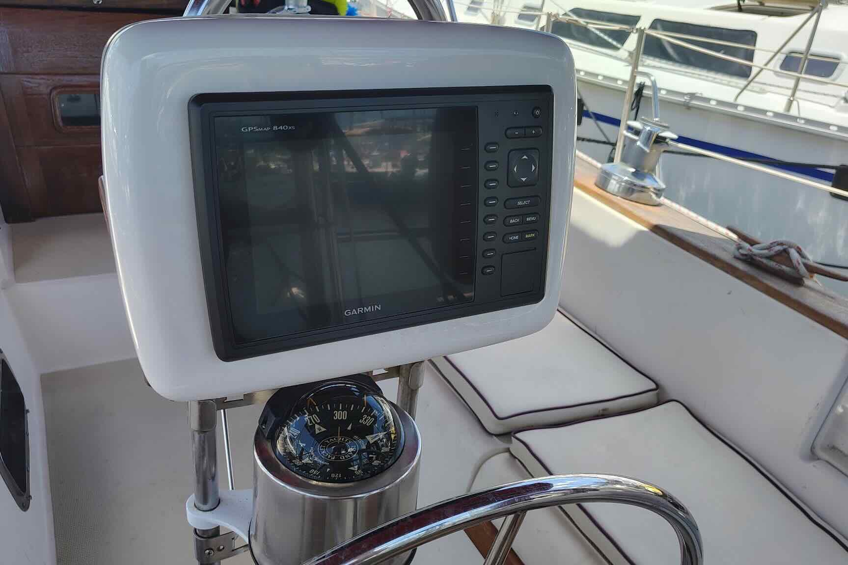 Garmin GPS and compass on 1989 Island Packet 35 sailboat cockpit.
