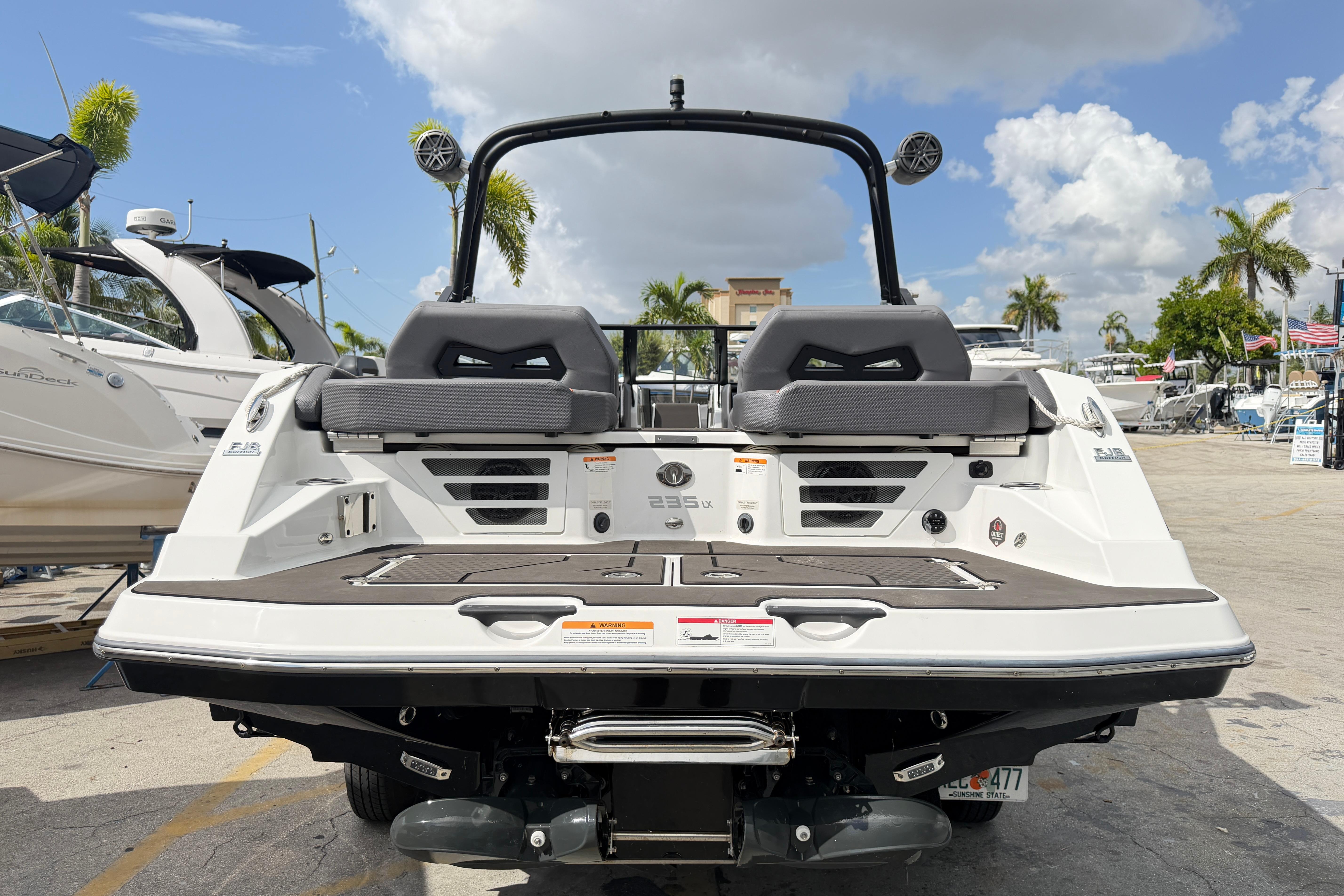 2026 Scarab 235 LX boat rear view, showcasing sleek design and modern features.