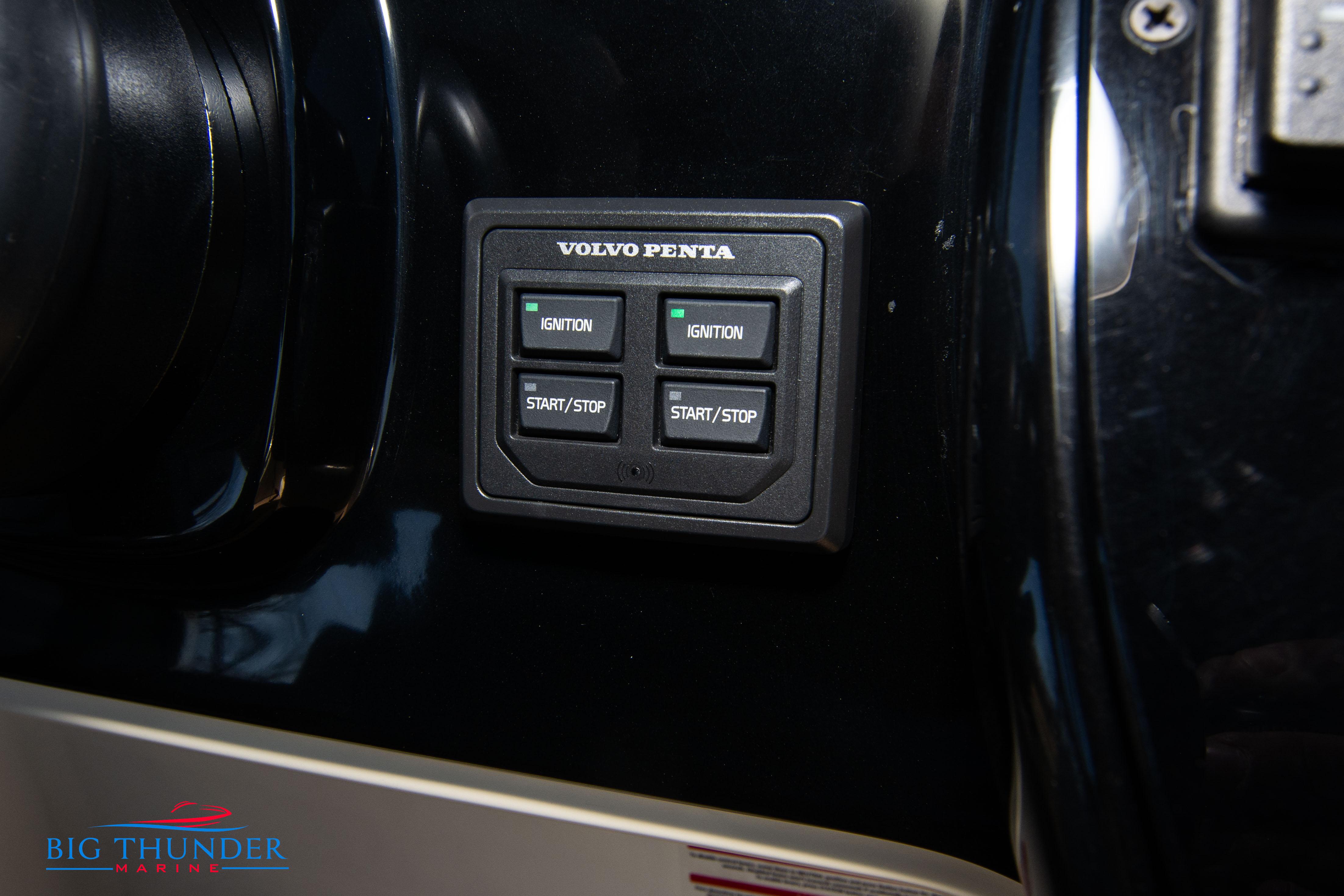 Control panel of a 2024 Invictus GT320 boat with Volvo Penta ignition buttons.