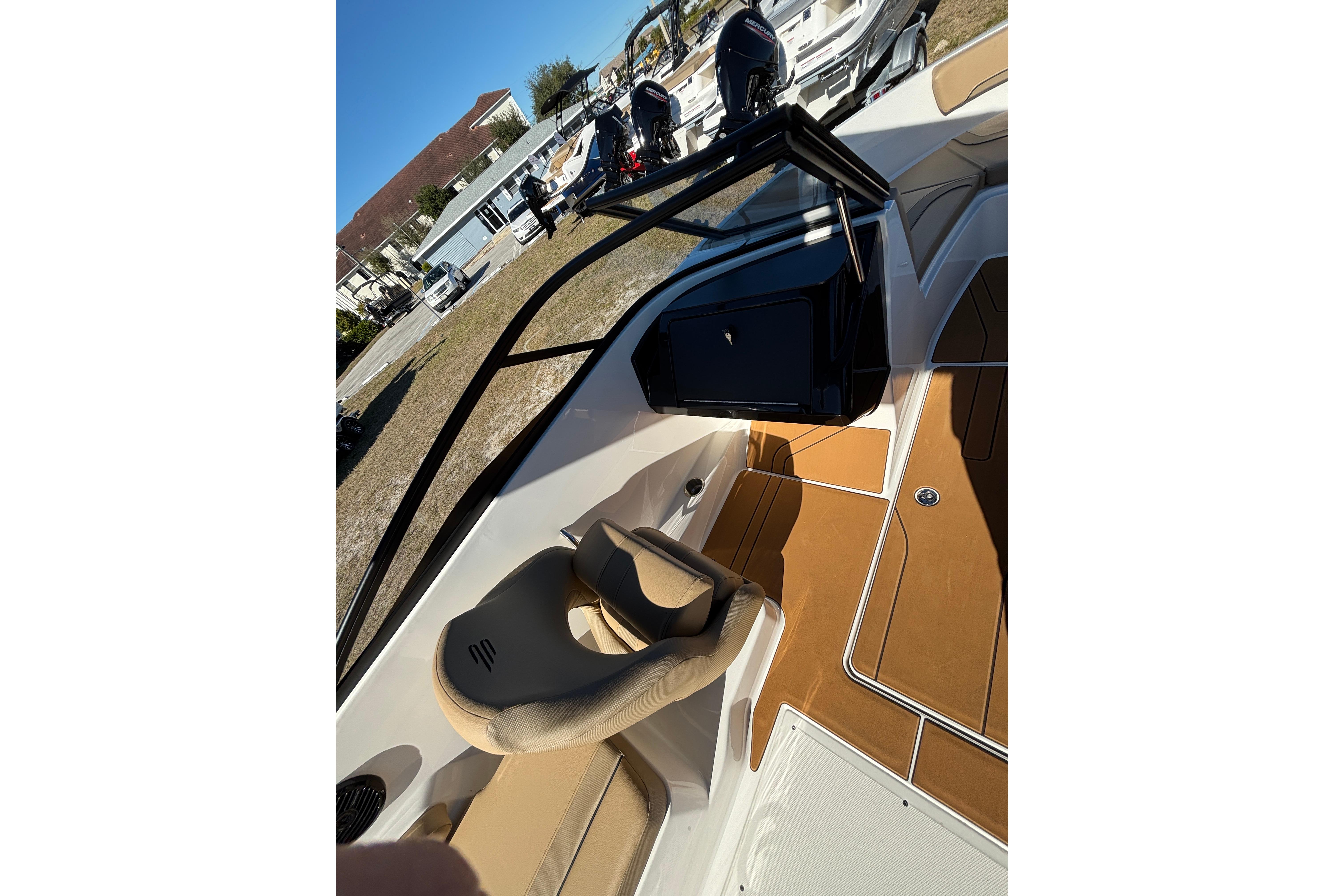 2025 Bayliner V20 boat interior with tan seating and sleek design.