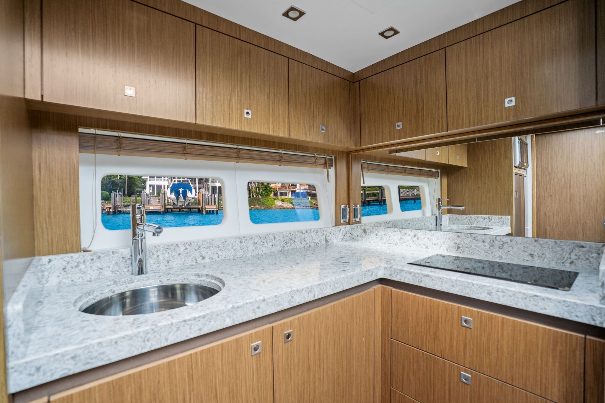 Interior of the 2017 Sea Ray Sundancer 510 with modern kitchen and large windows.