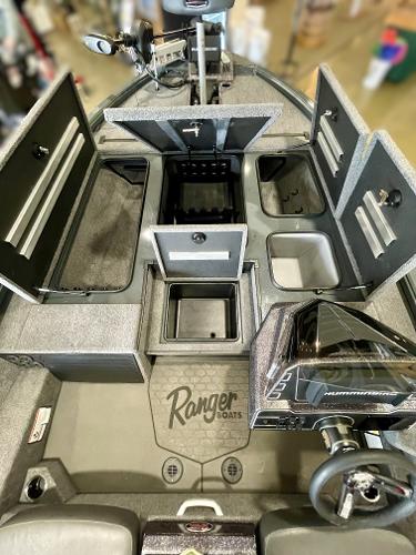 2025 Ranger ALPHA 208 boat interior with open storage compartments and steering console.