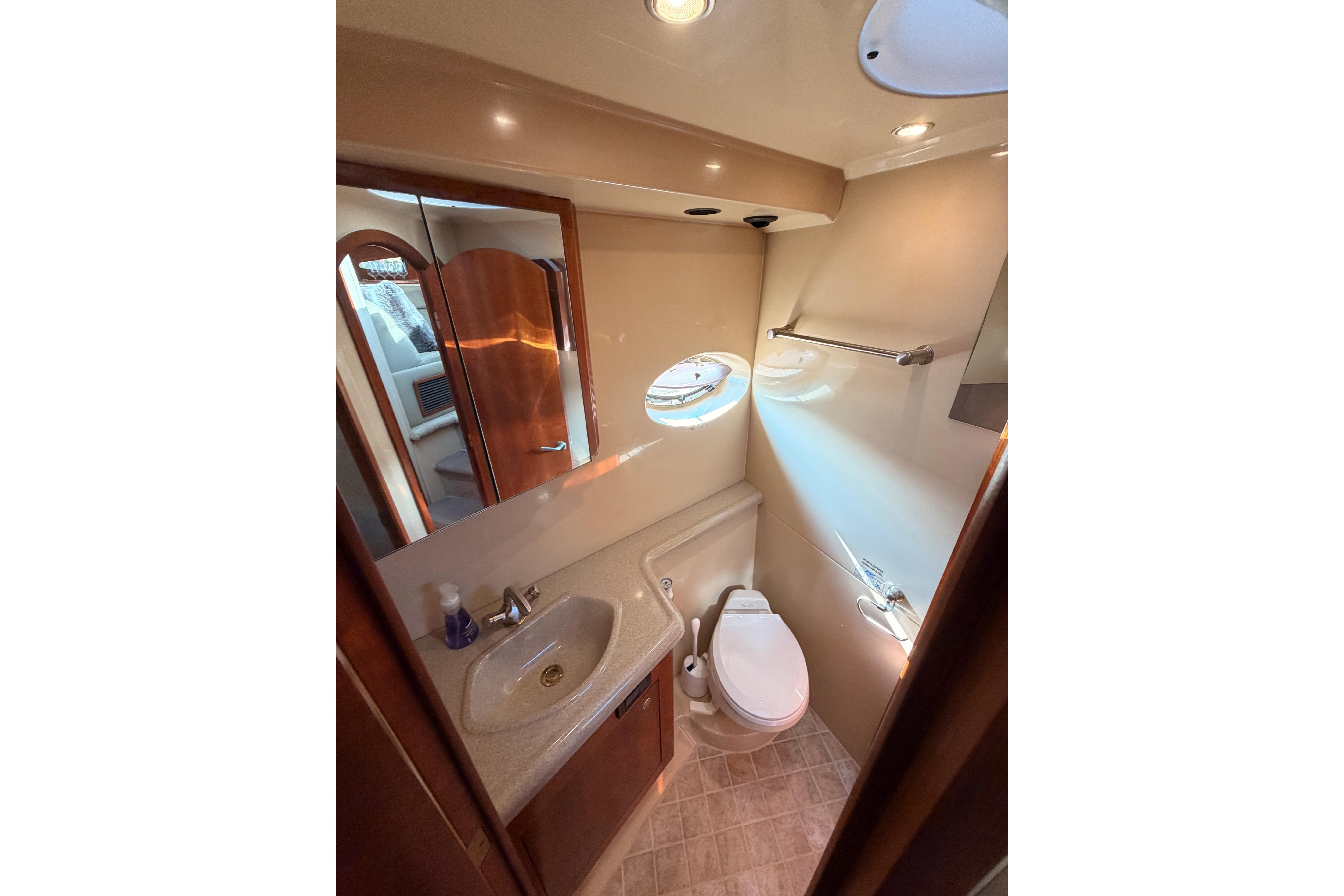 Luxurious bathroom in 2005 Cruisers Yachts 405 Express Motoryacht with modern fixtures.