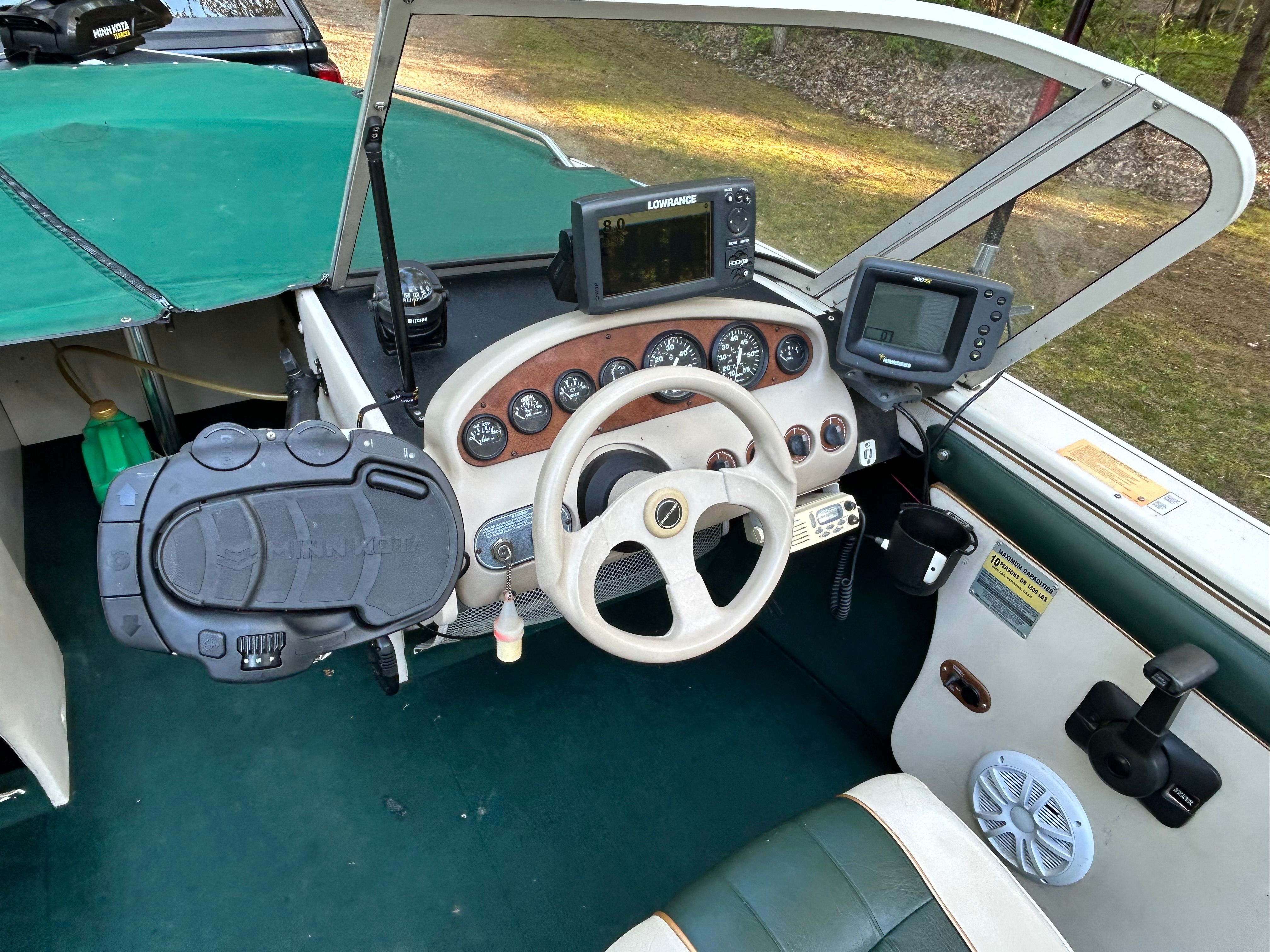Interior view of a 1997 Crestliner 2050 Sportfish boat with control console.