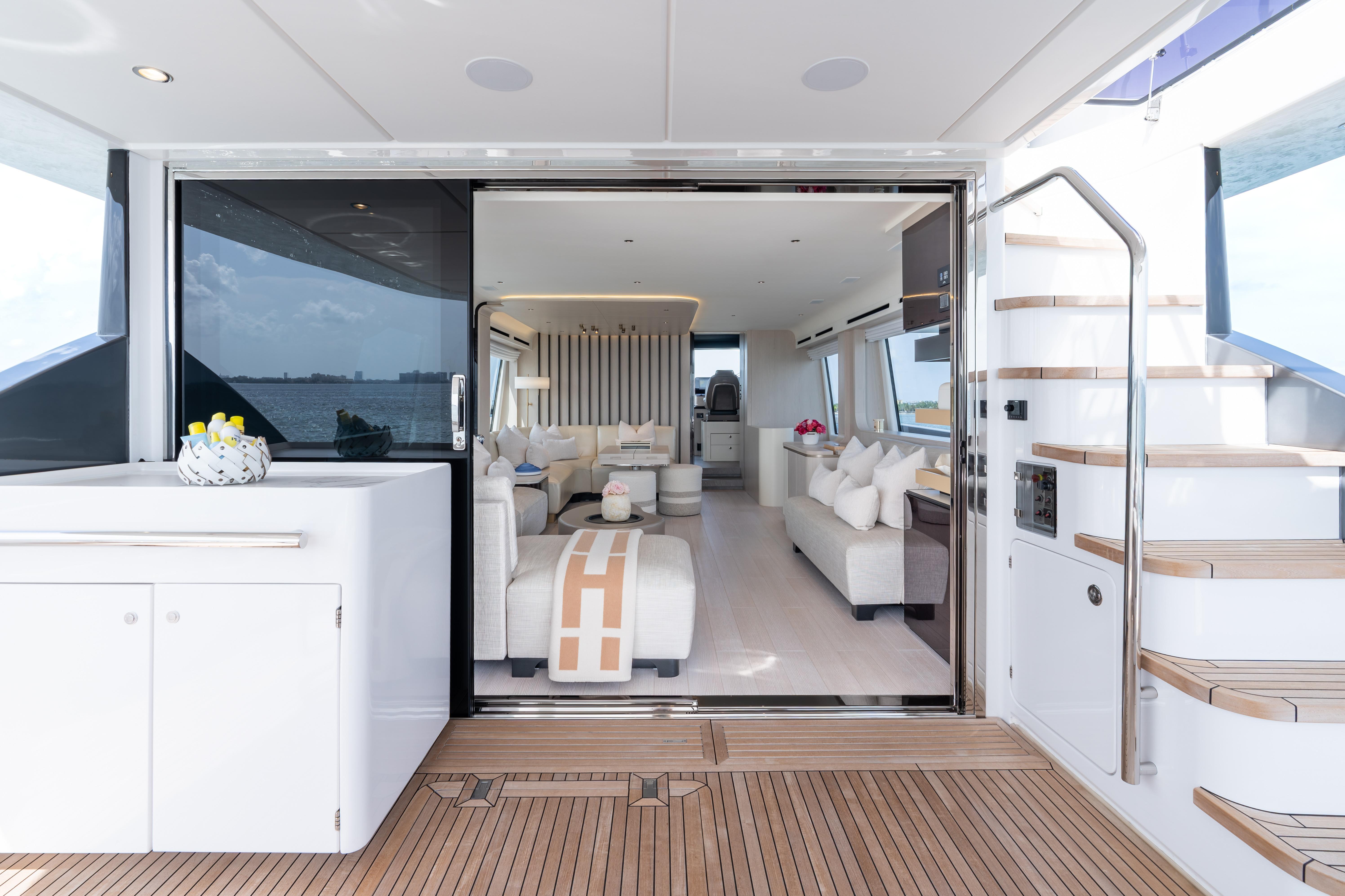 Luxurious interior of 2022 Azimut 78 yacht with elegant seating and modern design.