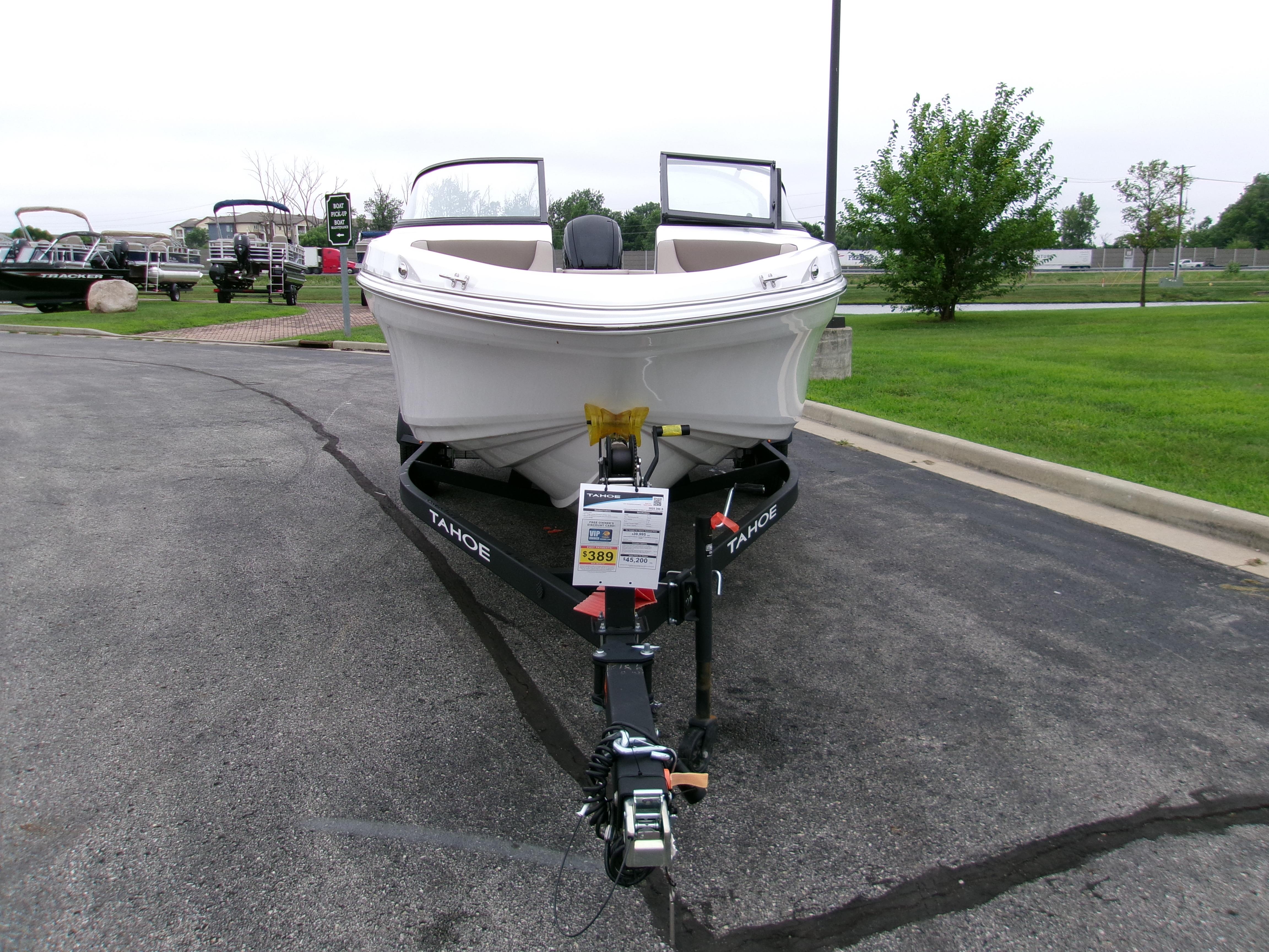 2025 Tahoe 200 S boat on trailer in outdoor dealership lot.