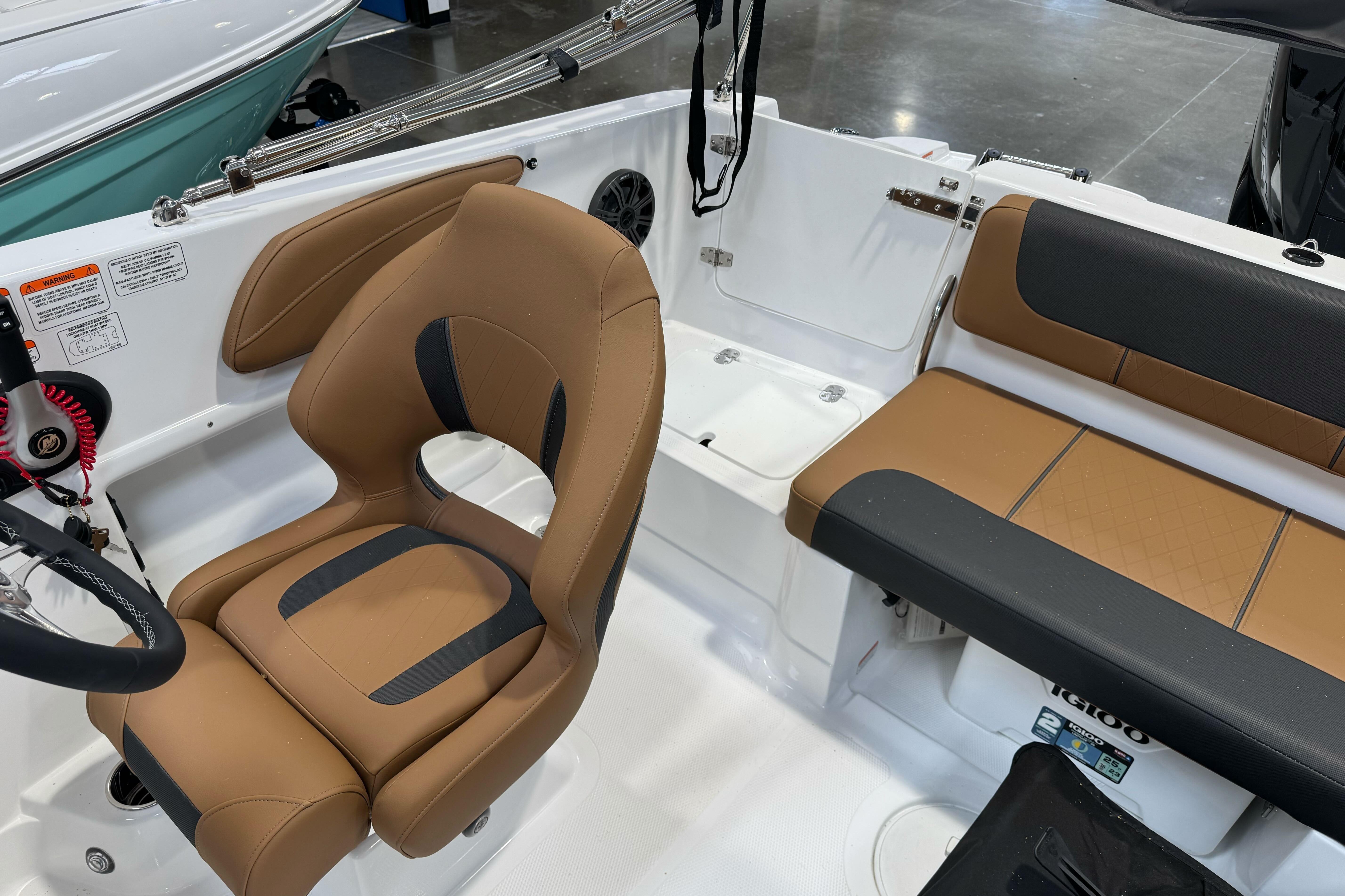 Interior of 2026 Tahoe 2150 boat with tan and black seating.