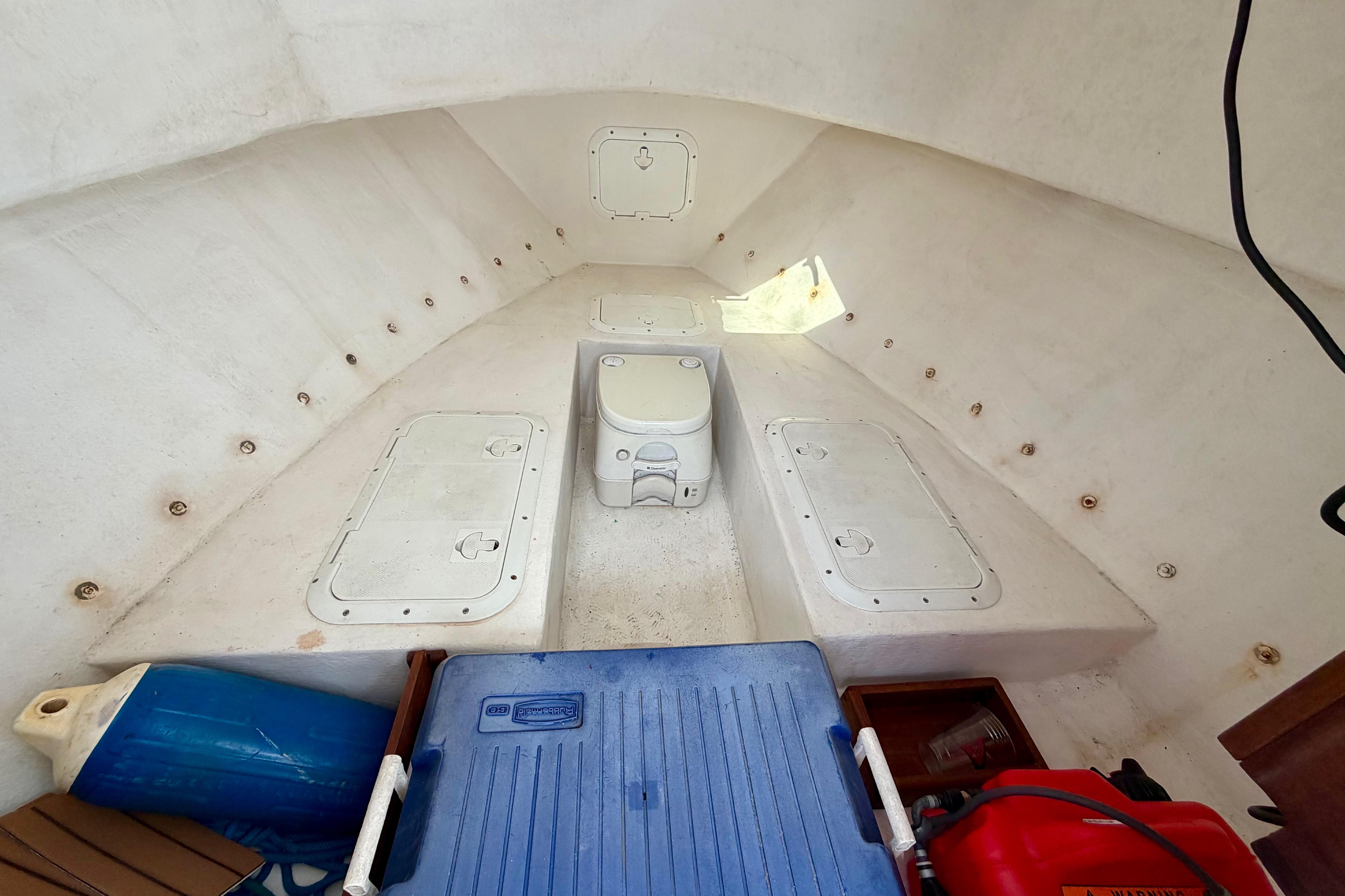 Interior of a 2000 Eastern 22 Lobster Fisherman boat with storage compartments.