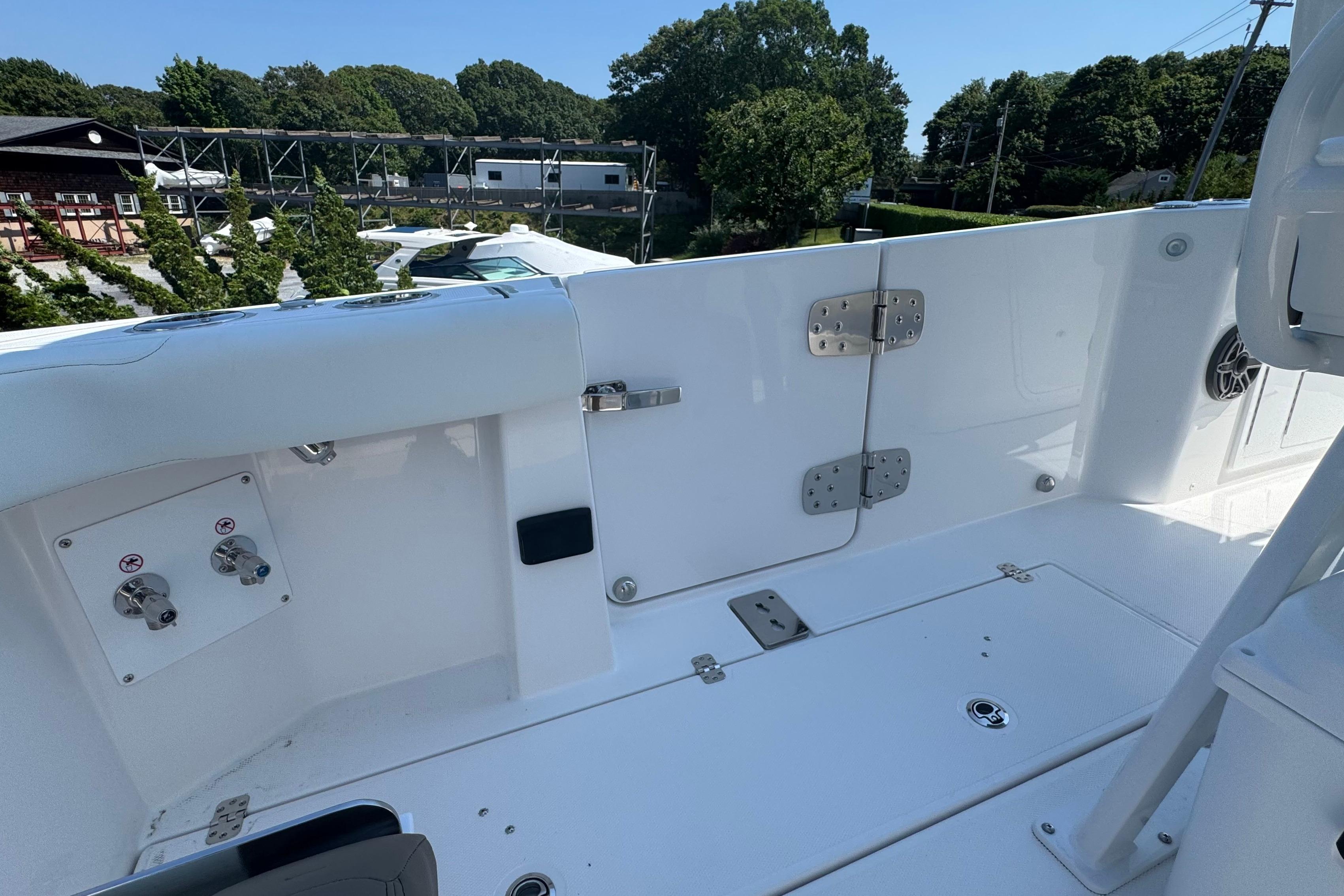 Edgewater 250CC 2026 boat interior, showcasing sleek white deck and modern fittings.